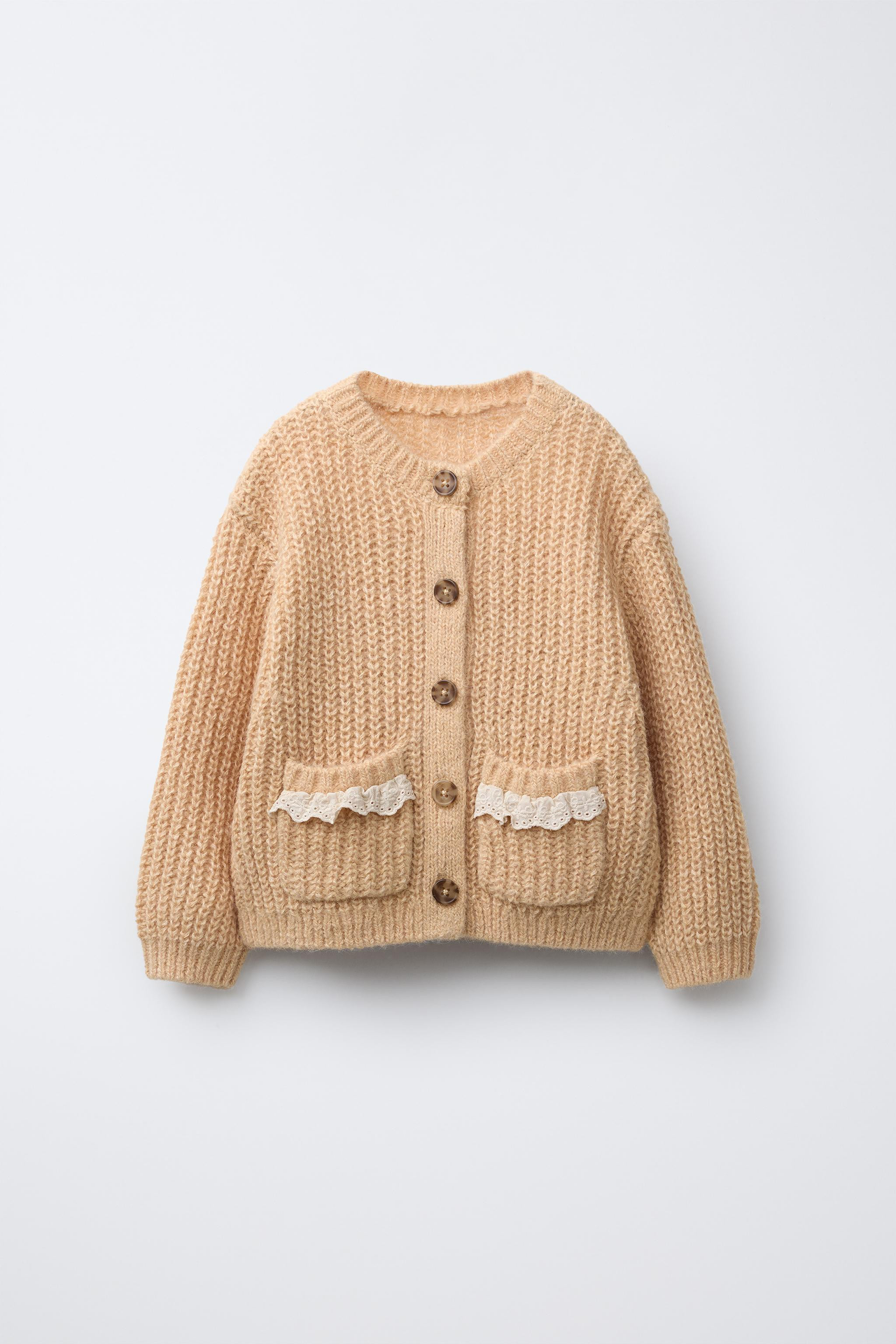 Knit cardigan with round neck and long sleeves. Front button closure. Patch pockets on the front ... | Zara Canada