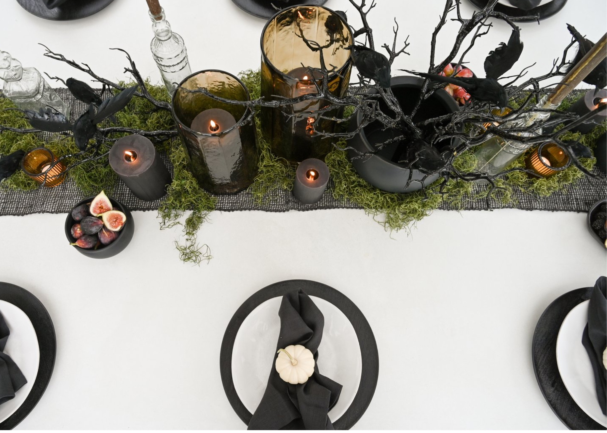 Neutral inspired Halloween party.

We styled this table with a cb2 table runner, large cauldron as a center piece, hurricanes with textured pillar candles, black wooden chargers, branches, creepy birds, and small white pumpkins for an elevated look. 

Halloween decor, fall decor. 

#LTKfindsunder50 #LTKHalloween #LTKSeasonal