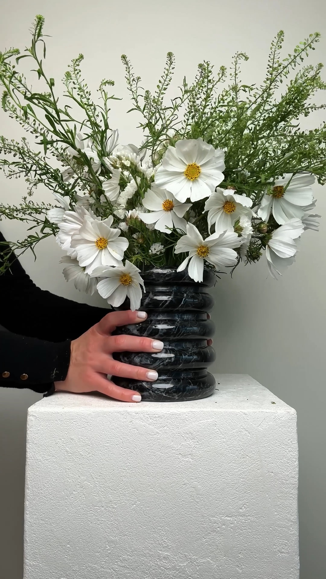 This sculptural black marble piece was actually designed as a utensil holder—but I repurposed it as a vase. The weight, texture, and clean lines make it the perfect unexpected vessel for wild, layered arrangements like this one. Styled here with statice, cosmos, and peppergrass for a moody, modern feel. Tap to shop the vase and recreate this effortlessly layered look with cosmos, statice, and peppergrass.


#LTKHome #LTKSaleAlert #LTKGiftGuide