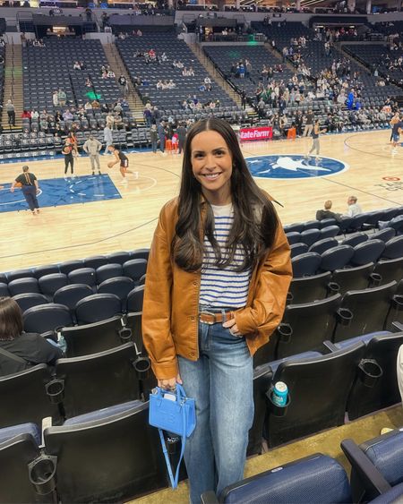 Basketball game outfit 🏀💙
Brown vegan leather jacket: true to size (S) oversized fit 
Tank: true to size (S)
Jeans: tts (26)
Sneakers: size down half 

Electric picks code TAYLOR20 💫 

Stadium bag / game day outfit 

#LTKitbag #LTKstyletip #LTKfindsunder100