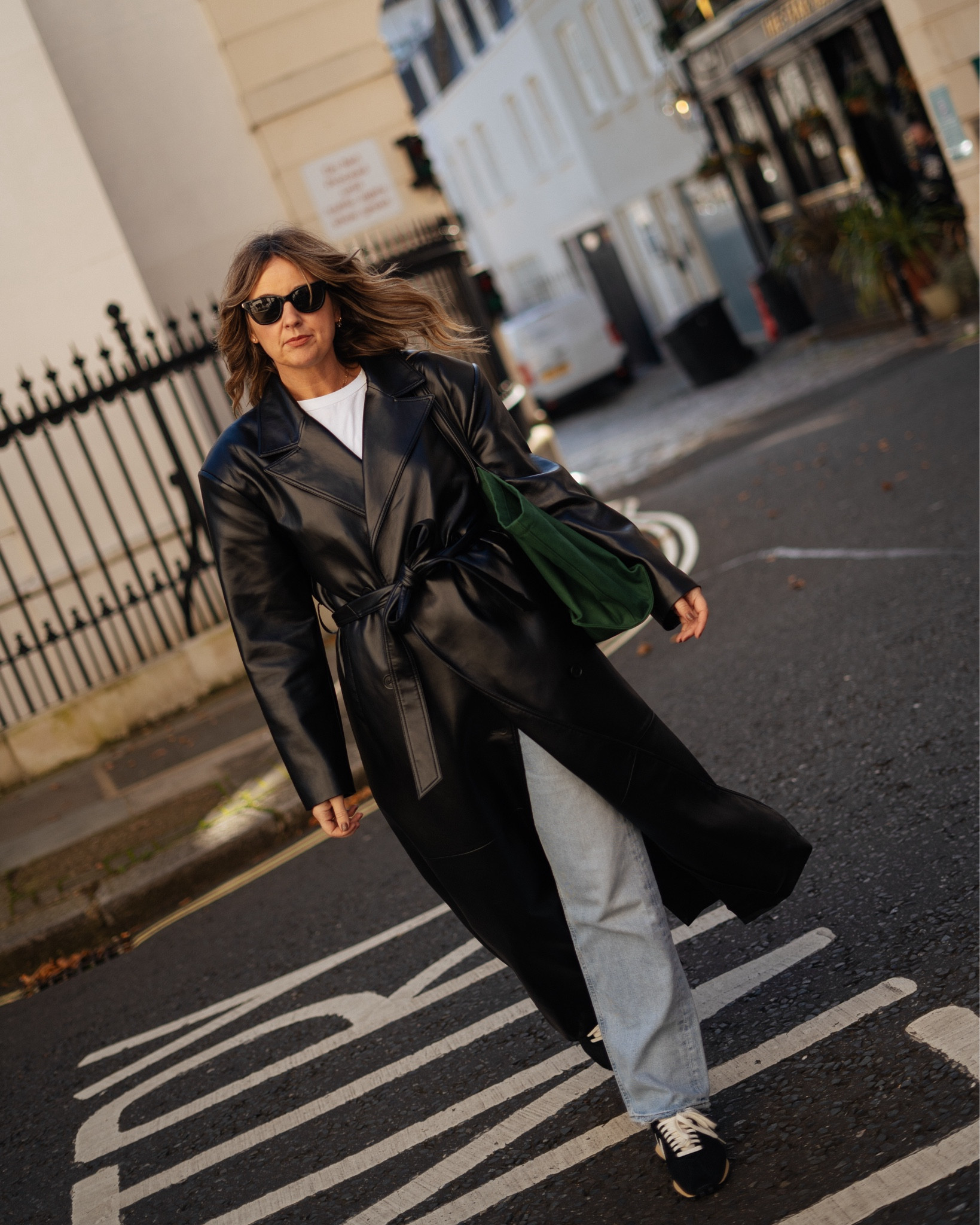 Leather Weather | Frankie Shop Faux Leather Trench Coat | The Row Green bag | Idaho Bag | Nikes | Agolde Jeans | 90s Jeans 

#LTKstyletip #LTKover50style #LTKautumn
