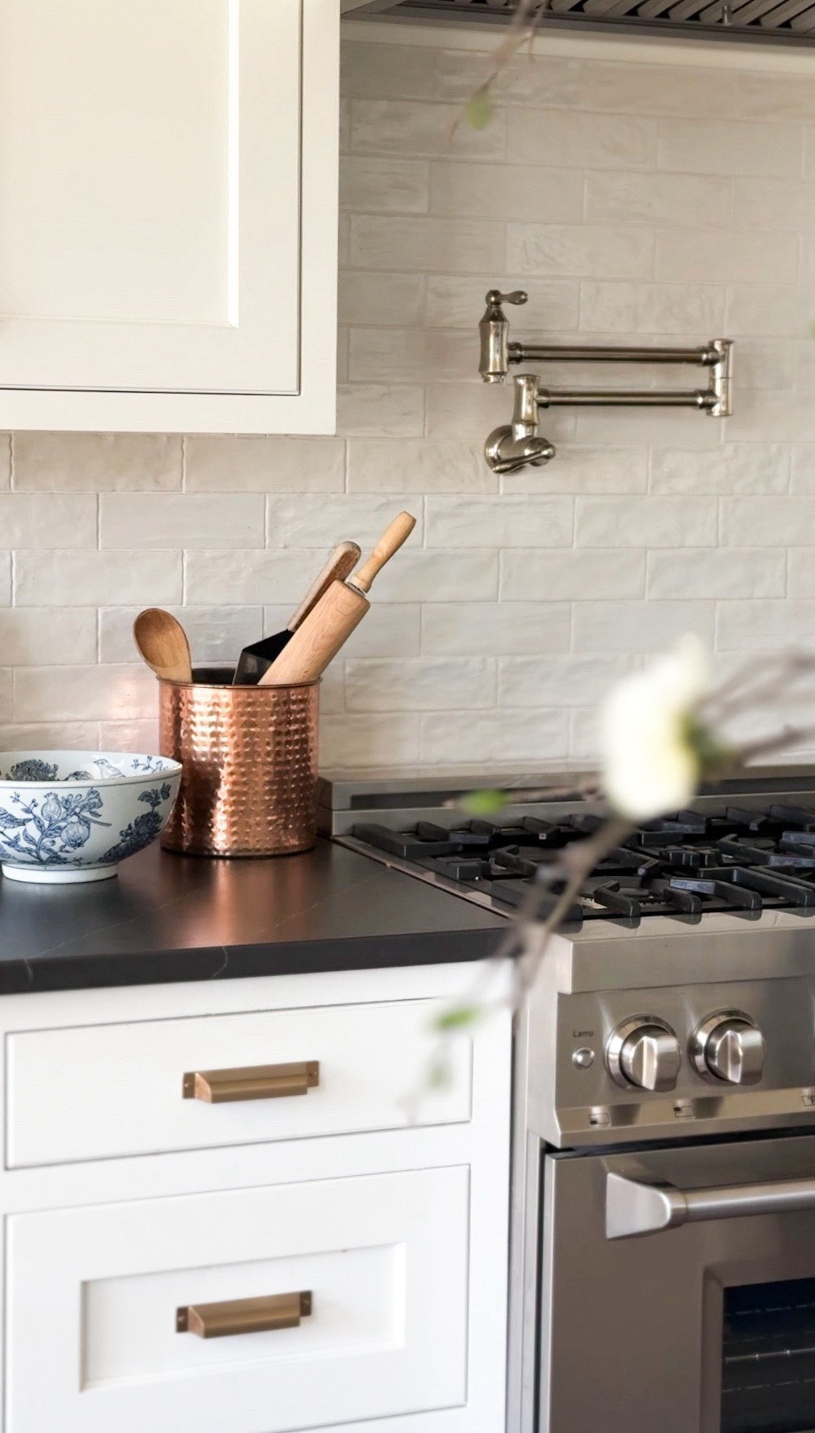 Kitchen views 🤍 I love adding warm metals like copper and brass to bring warmth into a white kitchen. 

This blue and white bowl is a new favorite and such an easy way to add a bit of color and character.

Linked everything I could for you 🤍