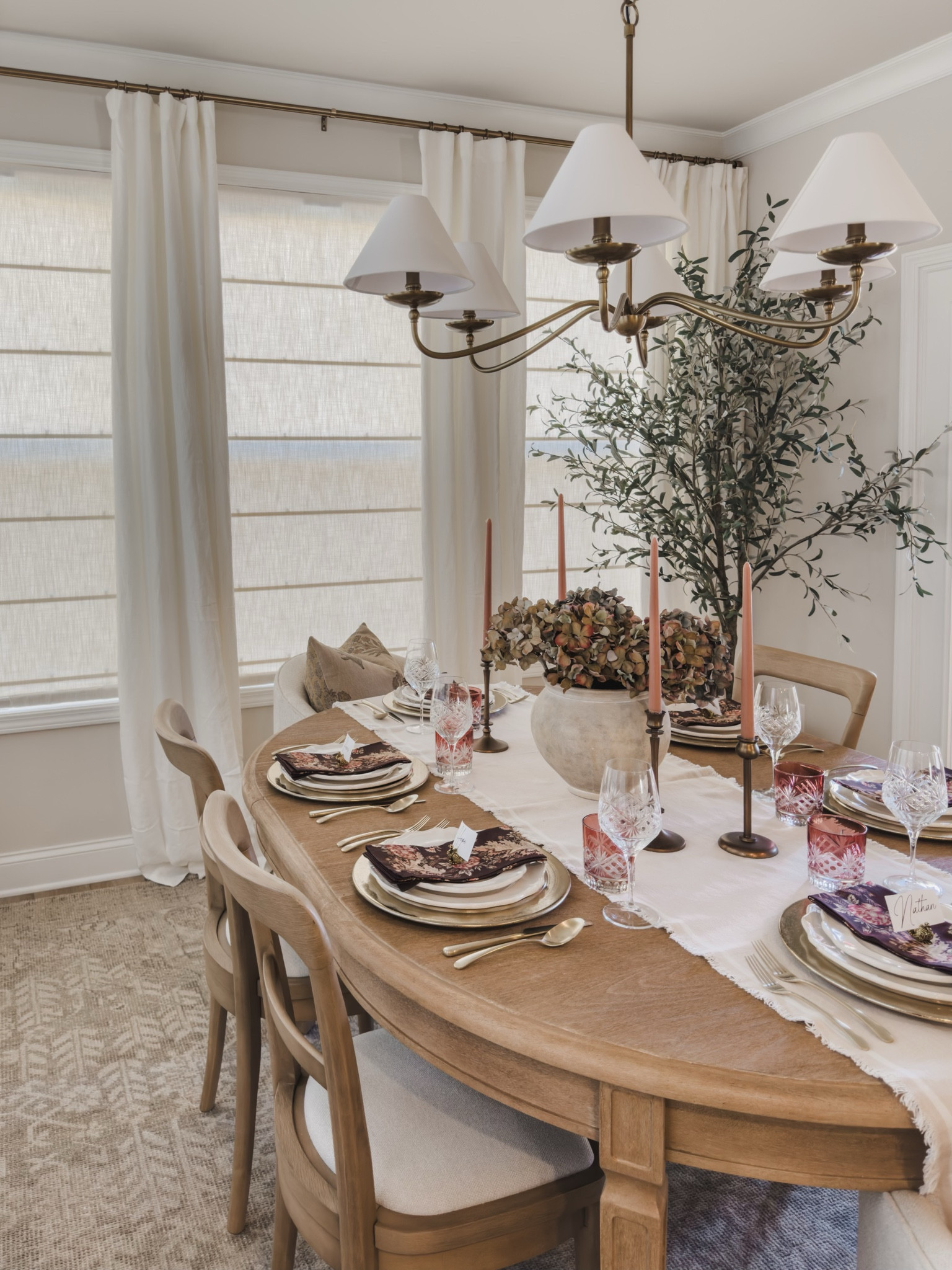 Thanksgiving table prep made easy with Pottery Barn! I mixed the timeless Heirloom Collection with the Rustic Metal Collection for a cozy yet classic feel. A warm, seasonal print and cute turkey place card holders lend to a seasonal finishing touch to make it extra inviting.

Holiday hosting, Pottery Barn style, neutral home inspo, neutral wood tones, furniture favorites, upholstered dining chair, faux olive tree, lighting detail, linen curtain, faux florals, tablescape details, charger plate, tapered candle, candle holder, gold silverware, placeholders, gold detail, shop the look!#LTKHoliday

#LTKSeasonal #LTKHome