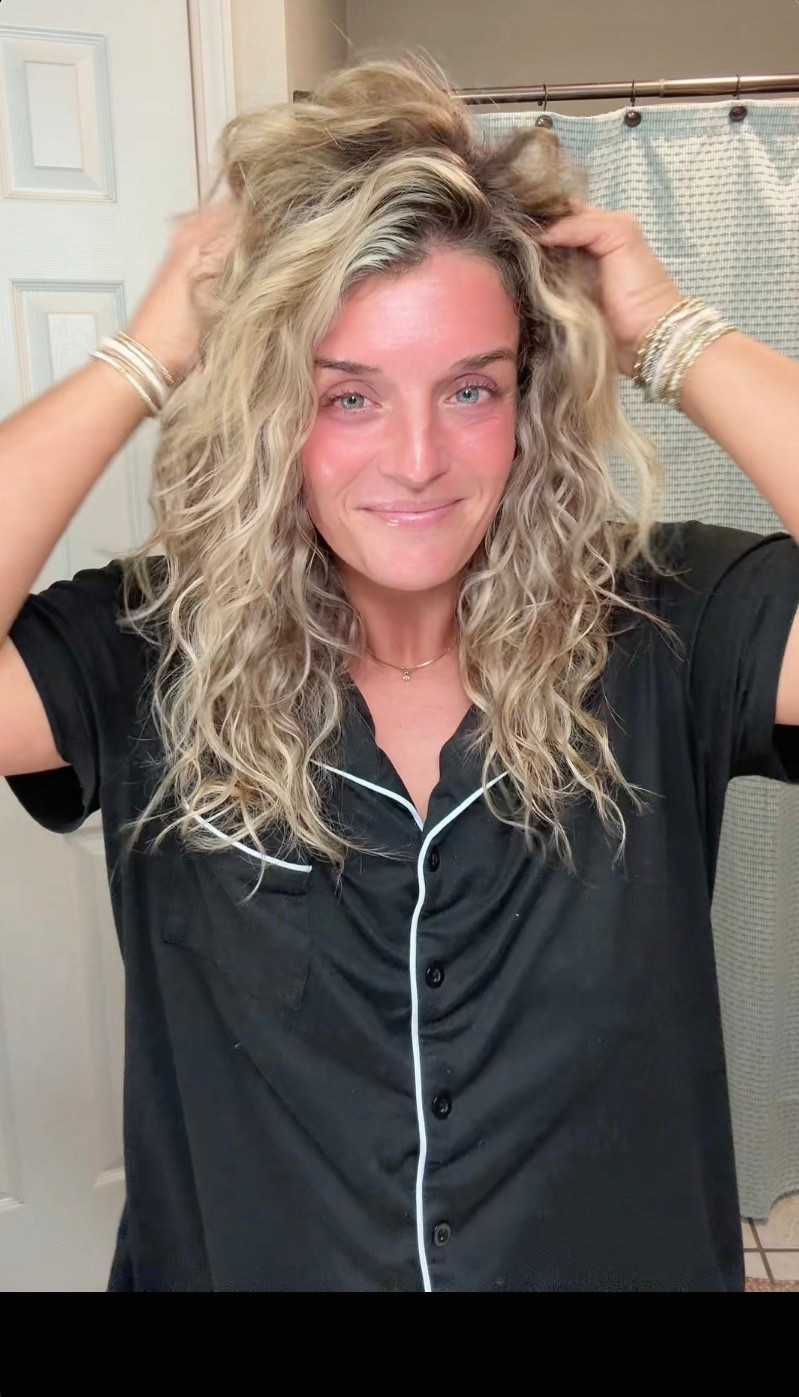 Here’s my full curl routine! I start with the CURLSMITH Hold Me Softly Style Balm for a soft, lightweight hold with zero crunch. Then I layer the Divi Air Dry Styling Cream to fight frizz and boost definition for 24 hours. I finish with the Lottabody Coconut Oil & Shea Wrap Me Foaming Mousse for extra bounce + shine. Diffused for about 2 minutes and let it air dry the rest of the way.  Once it is dried then I use a small amount of hair oil  Everything is linked!