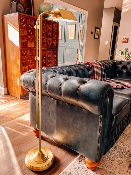 I like to sit in this corner of my couch in the library to read or work on needlework so I needed an adjustable floor lamp to illuminate the area. I love how this brass, vintage style lamp fits in with the aesthetic of the library while still being extremely functional! 

#LTKfindsunder100 #LTKhome
