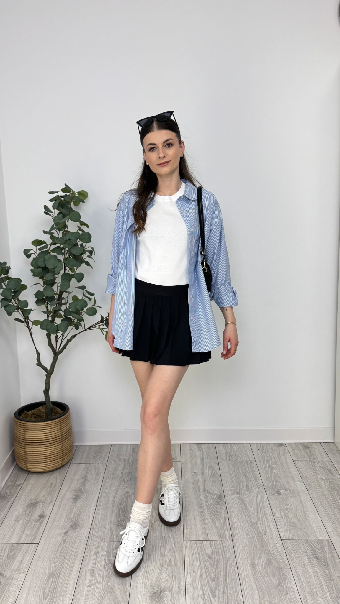 A relaxed striped button-down layered over a white tee gives this pleated mini skirt a sporty twist. Paired with comfy sneakers and socks, this look is made for stylish strolls and coffee runs 🩵 #IlaStylesDiary 

#LTKstyletip #LTKeurope #LTKspring