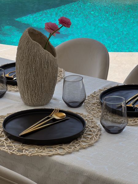 Summer Hosting 
Gold Modern Flatware Set - I’m paranoid about consuming materials that we shouldn’t be so after lots of research, if you want gold flatware, make sure it’s 18/10 stainless steel - it doesn’t peel off - these are amazing and dishwasher safe 
Charcoal dinner plates 
Smoke gray glassware 
Vase is homegoods 
Beige Dining chairs 
Straw Placemats 
Straw chargers 

Home finds 
Dining sets 
Wedding registry 
Outdoor hosting 
Crate & Barrel
Outdoor dining 
Backyard 

#LTKhome #LTKparties #LTKsalealert