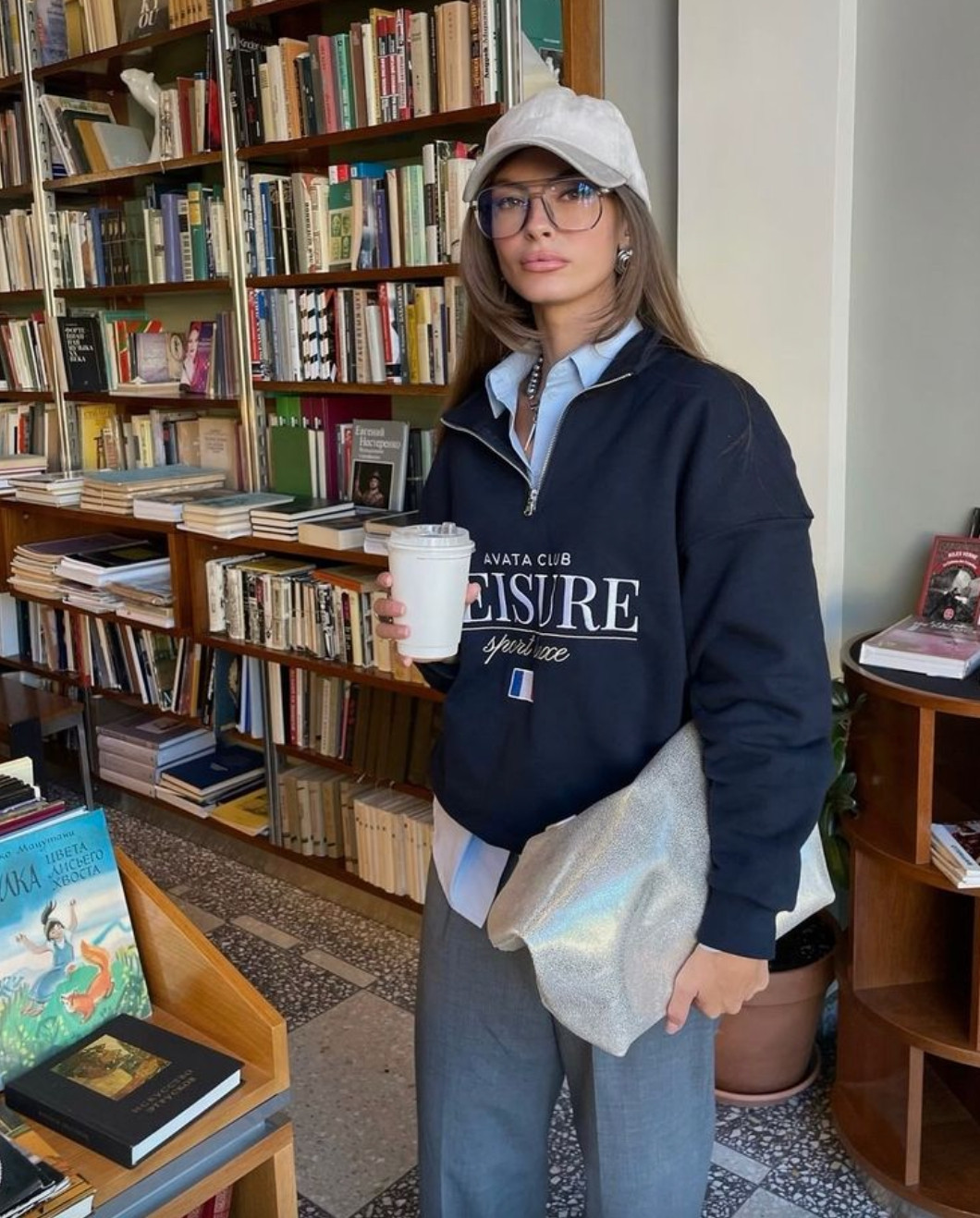 This elevated casual outfit layers a sporty pullover over a crisp button-down with tailored trousers for a polished off-duty look.
A baseball cap, statement glasses, and structured accessories add personality while keeping the outfit effortlessly chic and modern. 

 #LTKdayinmylife #LTKootd