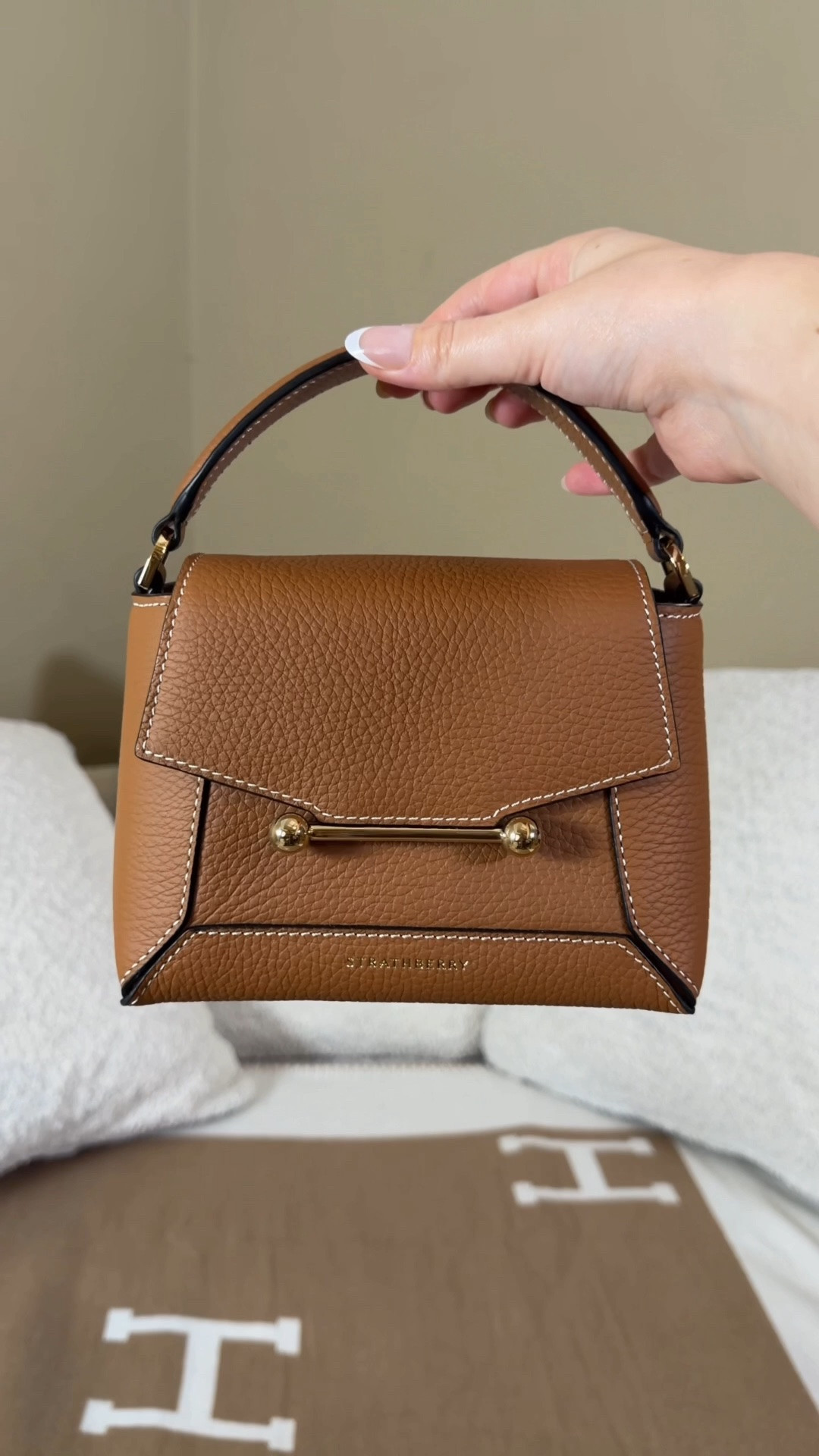 Kate Middleton made me buy it 👜

I recently went to Edinburgh and shopped at Strathberry to see the bags that princess kate and Meghan Markle have been seen carrying and they did not disappoint! Every one was so kind and every single bag is beautiful, which is why I’m so glad I have two now!

First I got the mini tote which is the smaller version of one that Meghan Markle was spotted with and now I have the nano mosaic which is the tan version of the one Kate Middleton was spotted with.

Years ago I saw Kate Middleton carrying and Meghan Markle carrying these Strathberry bags and I loved the signature golden bar which I learned was inspired by vintage sheet music that the founder found in their town home in Edinburgh.

Stratherberry is an Edinburgh based luxury leather brand and these bags are not only beautiful but Amazon quality! I knew I wanted a nano mosaic or a tote but but when I got to the store I couldn’t decide because there were so many other beautiful options as well 😍

The tote comes in a nano, mini, midi, and regular size white the mosaic comes in either nano or regular.

They had the cutest leather bag charm too including a Nessie charm and highland cow. I each strathberry location also has an exclusive silk Twilly that you can only get in store so you know I had to get that! 

Which bag do you think I got?!

Strathberry bags, strathberry midi tote, nano mosaic Kate Middleton style Meghan Markle style