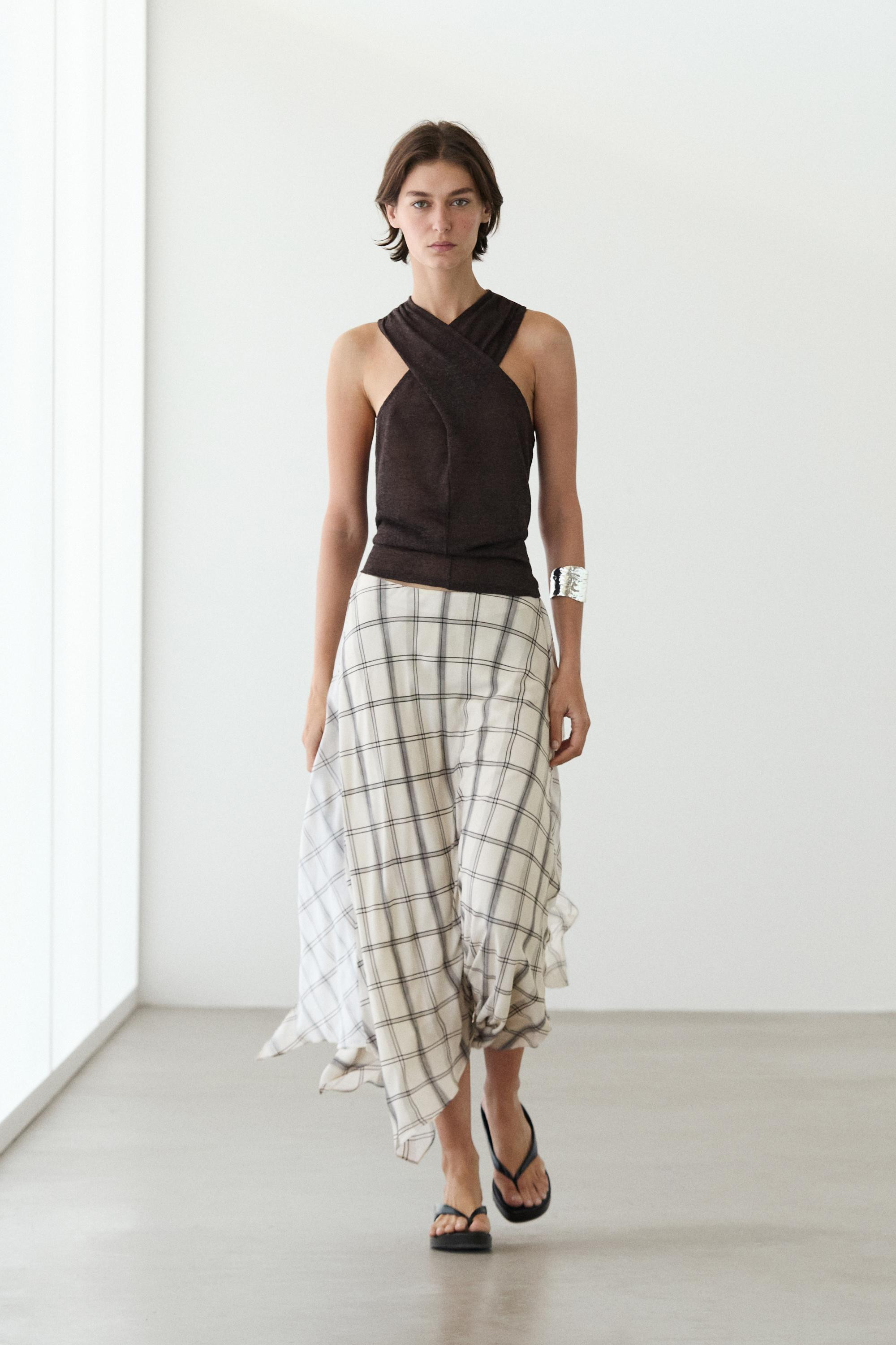 VIEW LOOK
Asymmetric midi skirt with check detail
    
 $180  Colour  White  Add to basket Colour... | Massimo Dutti US