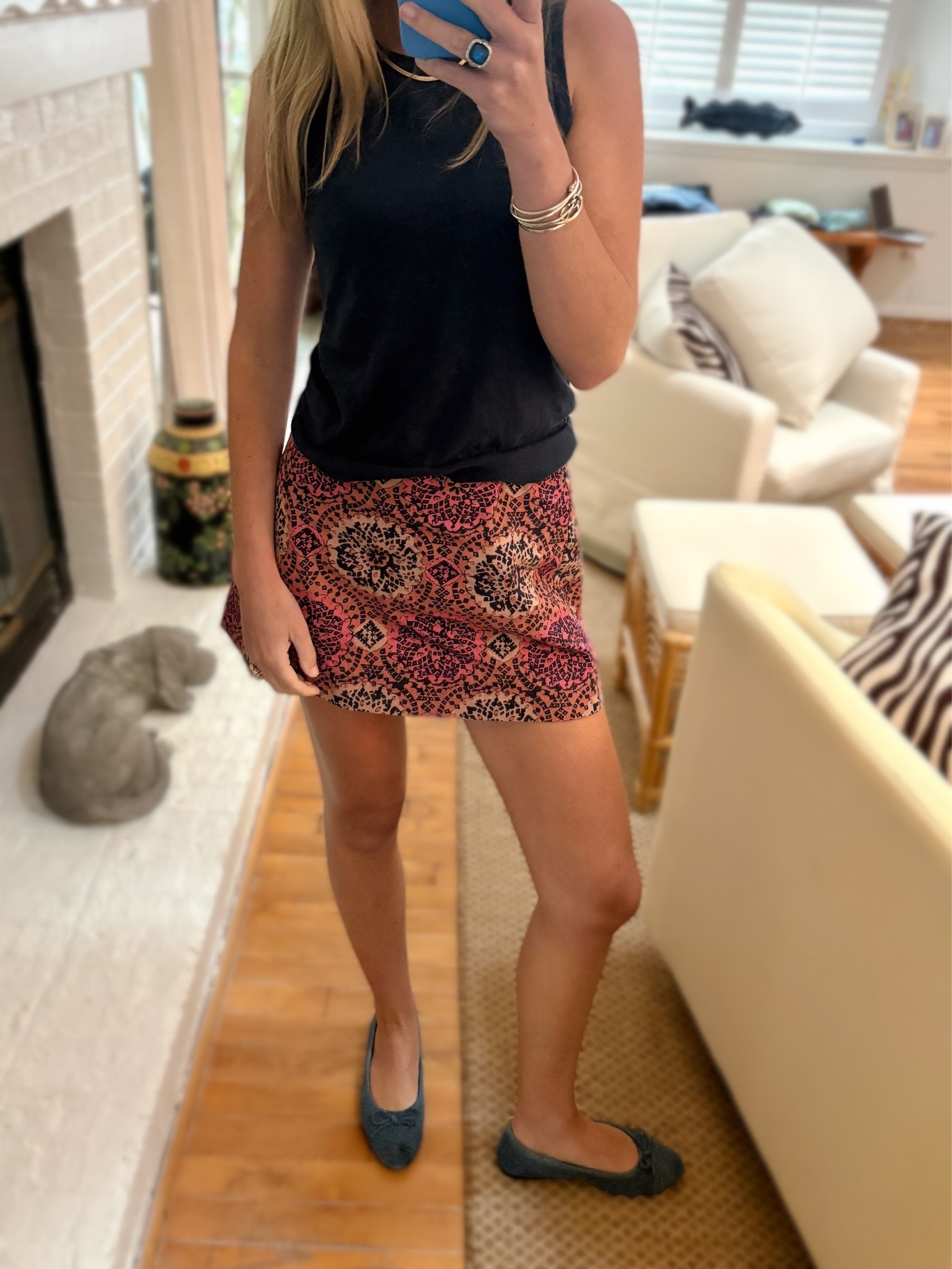 Black sleeveless top, paisley print mini skirt. 
Skirt: true to size, elastic waist wearing a small 
Top: relaxed fit, TTS wearing a small

#LTKootd #LTKSaleAlert #LTKTall