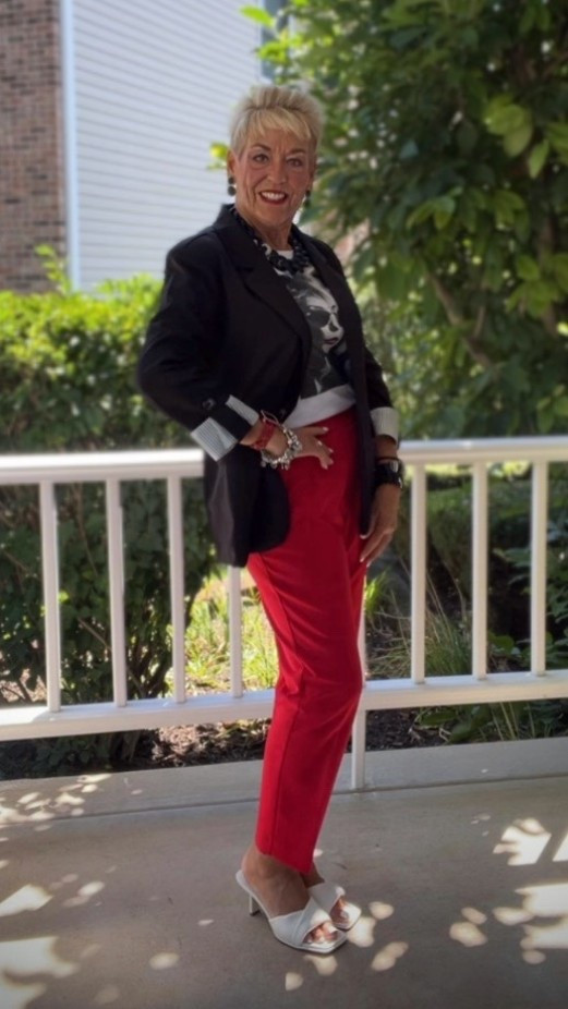 Black Blazer with Striped Cuffs
Red Pants
Graphic Tshirt
White Slides
