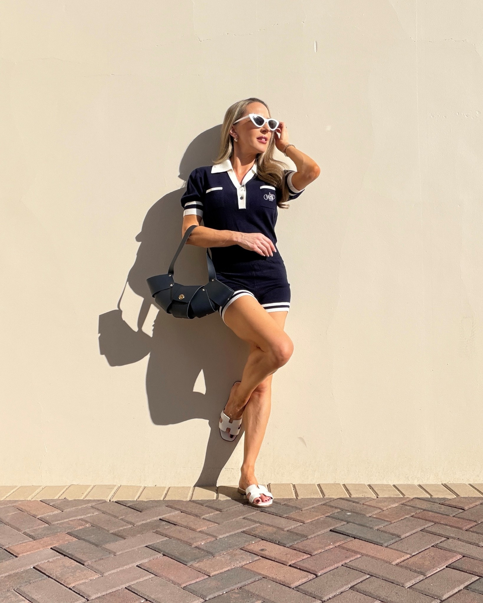 Cute + comfy outfit inspo from WISKII Active 💙 I’ve been loving pieces that feel easy to throw on but still look put together & this navy playsuit / navy romper is such a good everyday outfit idea for working from home or running errands and it’s on sale. WISKII Black Friday Early Access Nov 6–8th🎉 You get 23% off all orders with my code: EVE23 or 15EVE for 15% OFF after the sale ends 🌟 
• WISKII Stay Put Straps white sports bra (wearing size small).
• WISKII V-Neck Polo Short Sleeve Playsuit in navy size small.
• Steve Madden white leather slide sandals.
• Manuel Dreesman navy croissant bag. 

#LTKStyleTip #LTKSaleAlert #LTKPetite