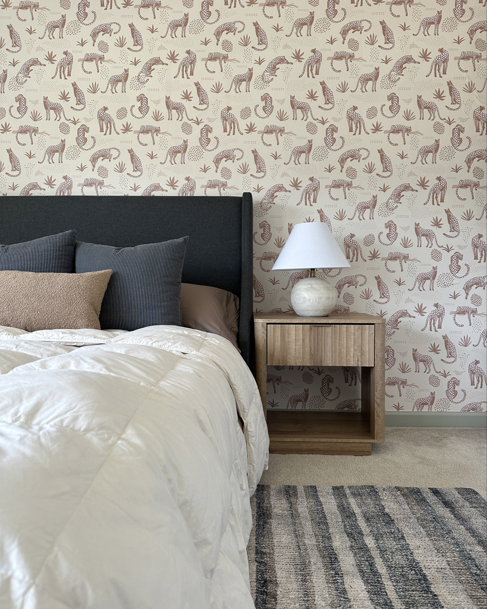 Toddler boy room inspo! 
Cheetah wallpaper, red curtains, and affordable bed and nightstands! 
The bed is low to the ground, so perfect for kids and the curved corners on the nightstands prevent heads from being hurt if they bump them!

#LTKHome