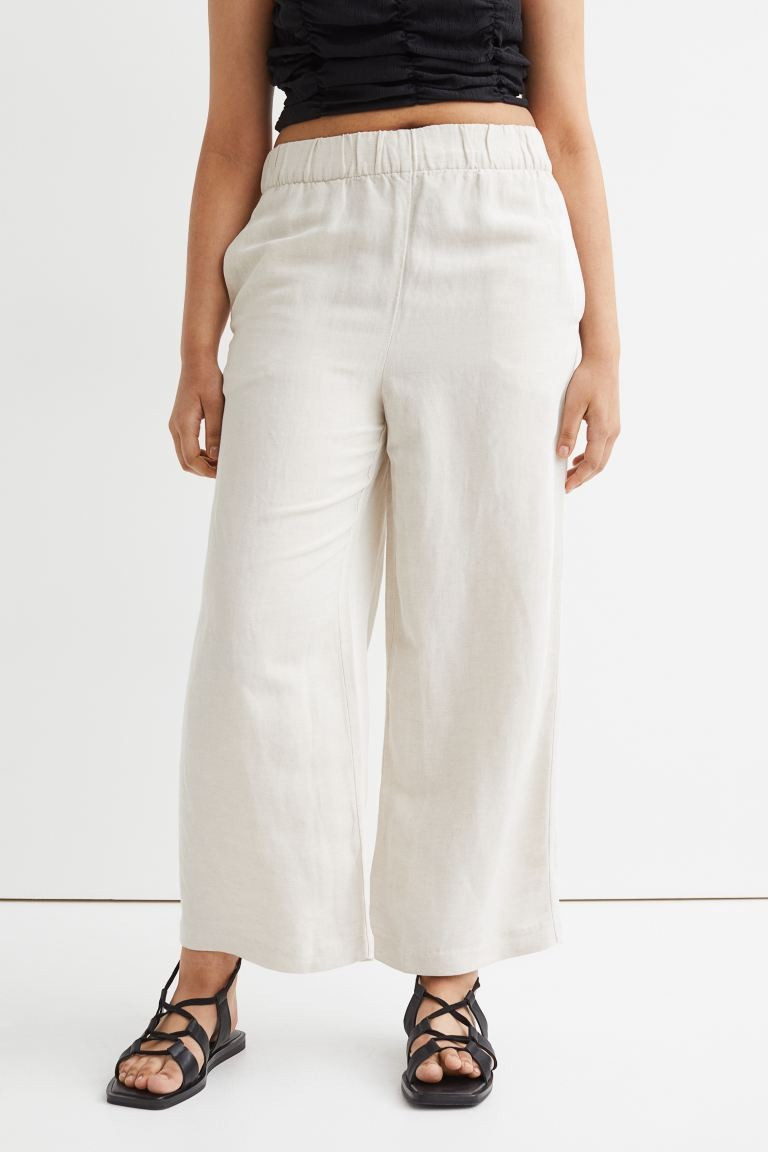 Conscious choiceLuźne szerokie spodnie do kostki wykonane z tkaniny z mieszanki lnu i wiskozy. W... | H&M (DE, AT, CH, NL, FI)