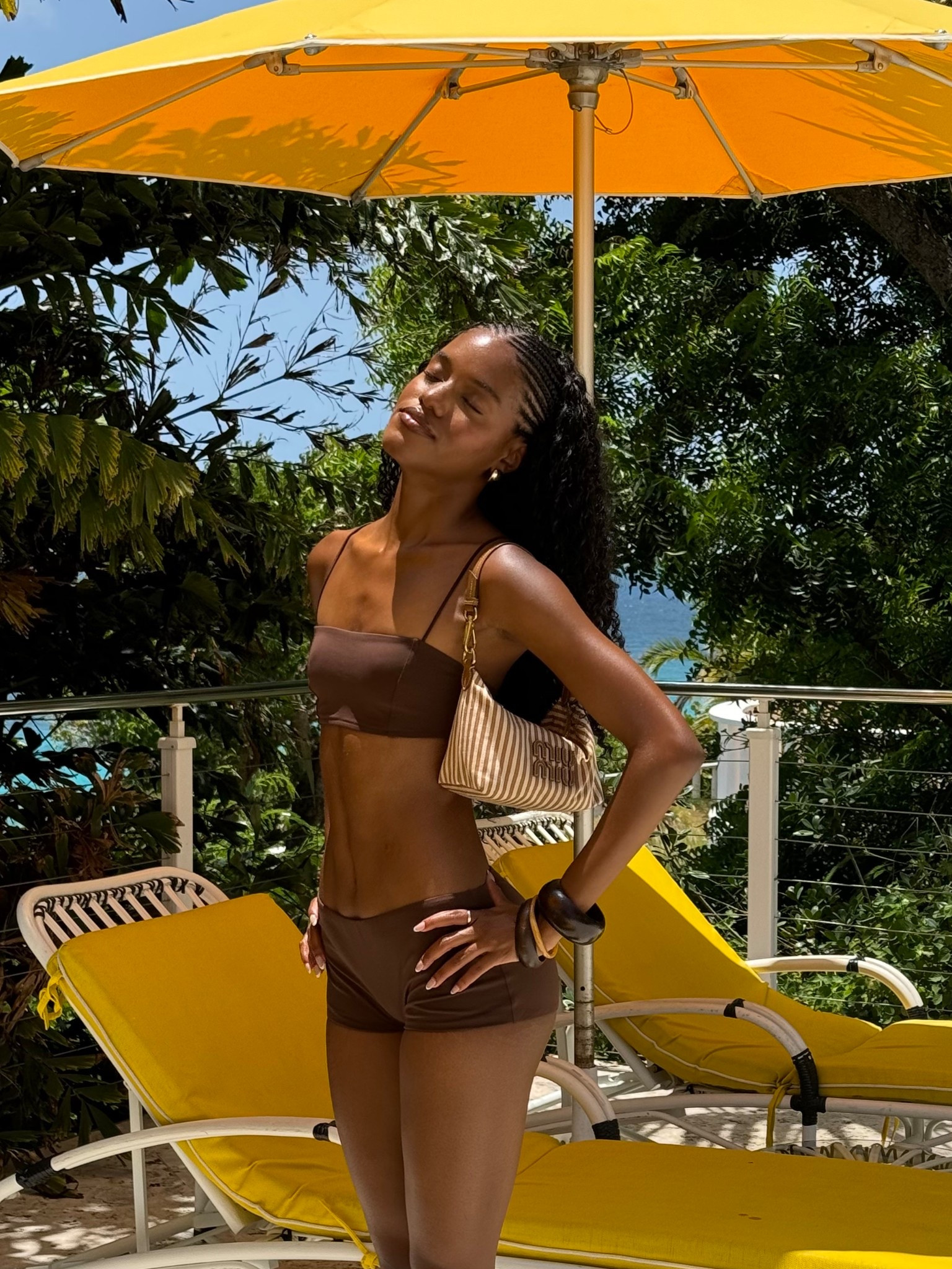 Brown Reformation swimsuit 
