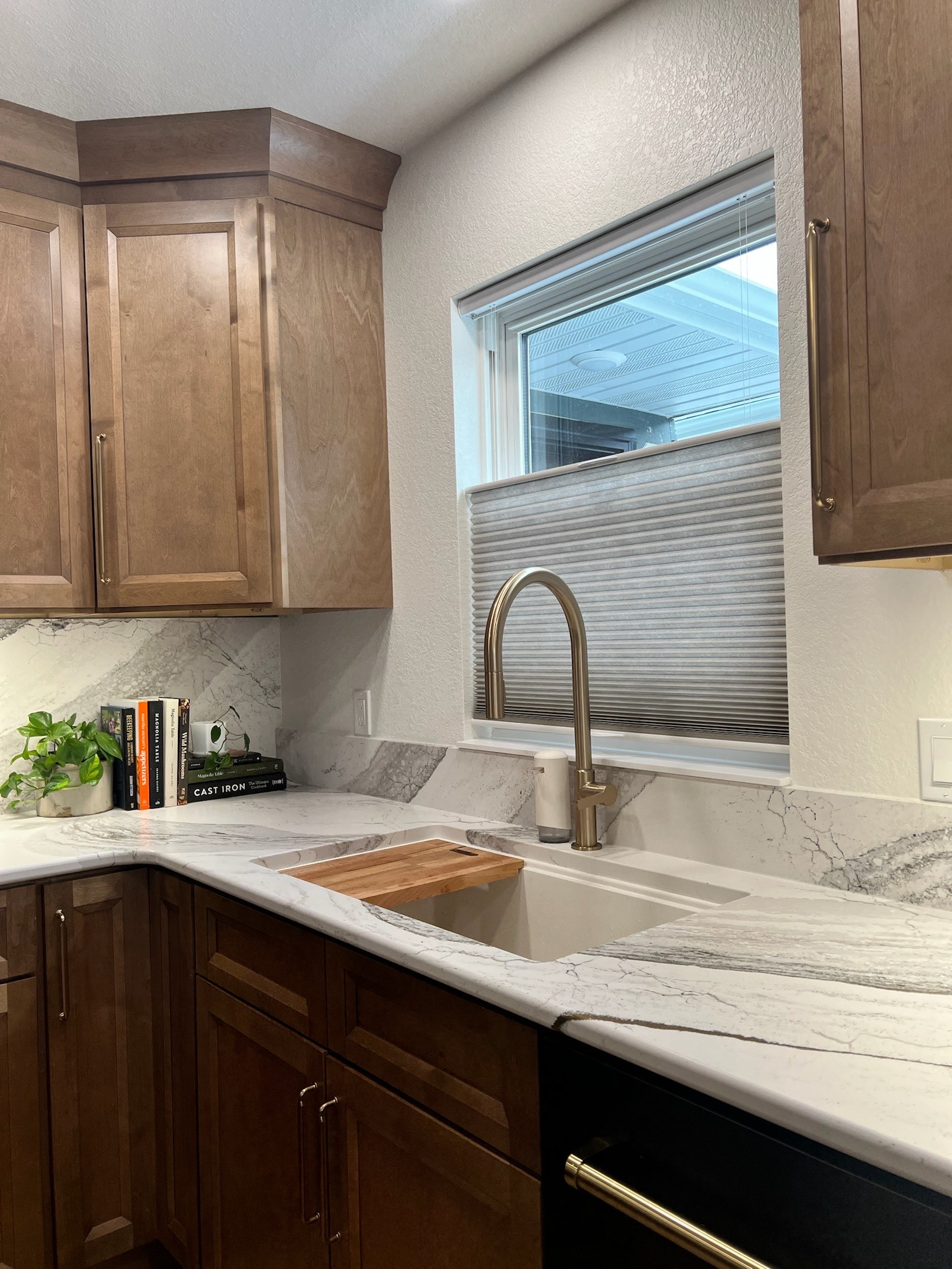 Champaign bronze fixtures, black appliances, and wood cabinets 🫶🏻

#LTKHome #LTKFamily