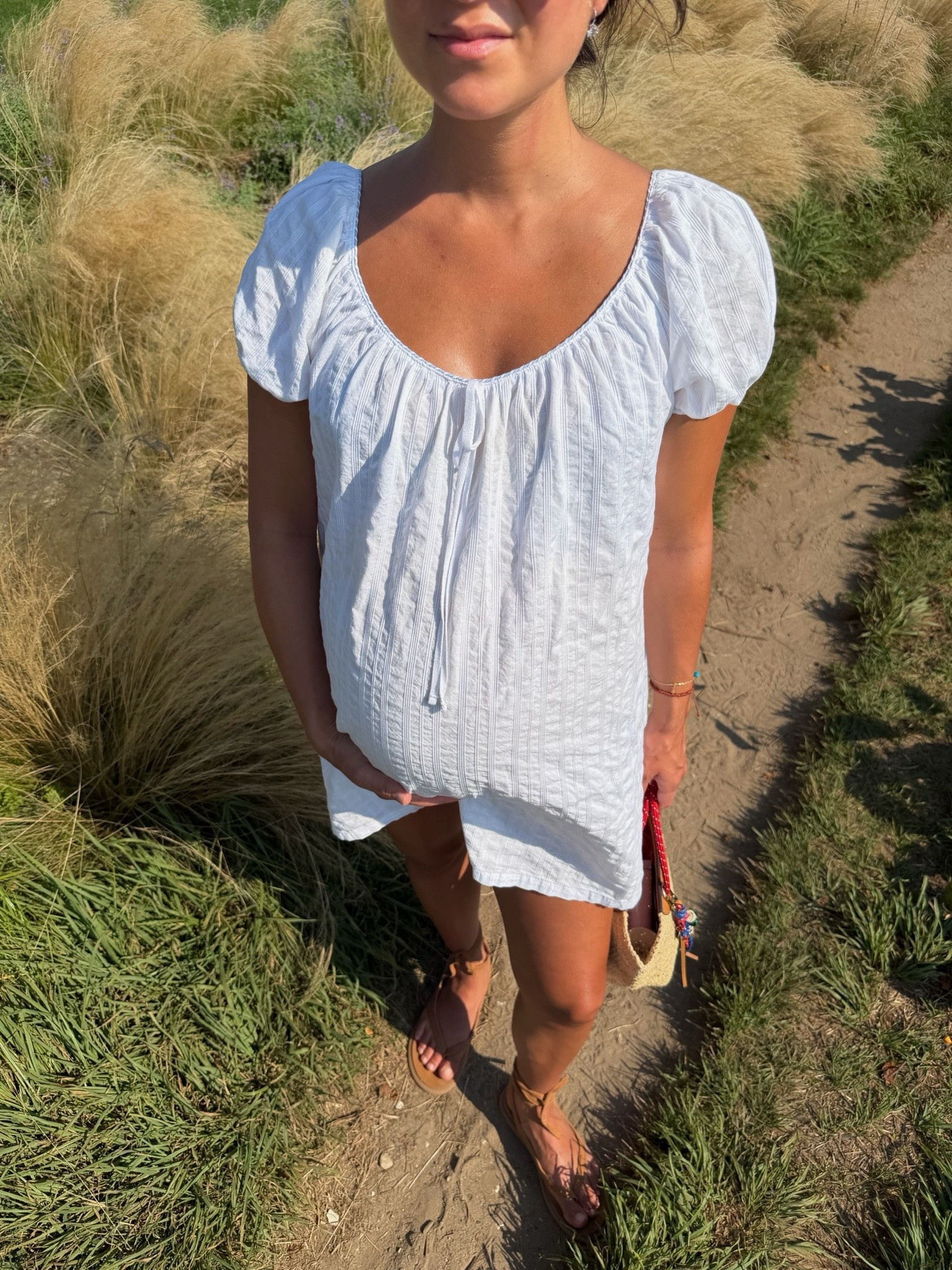 [8/11/26] nantucket days ⚓️🐋🌾 dress is 100% cotton + on sale for 30% off! 

sizing:
• aerie white seersucker dress, small + 100% cotton - currently on sale for 30% off! 
• sandals are dolce vita 
• bags are Madewell + j.crew + accessories are @baublebar and @electricpicks