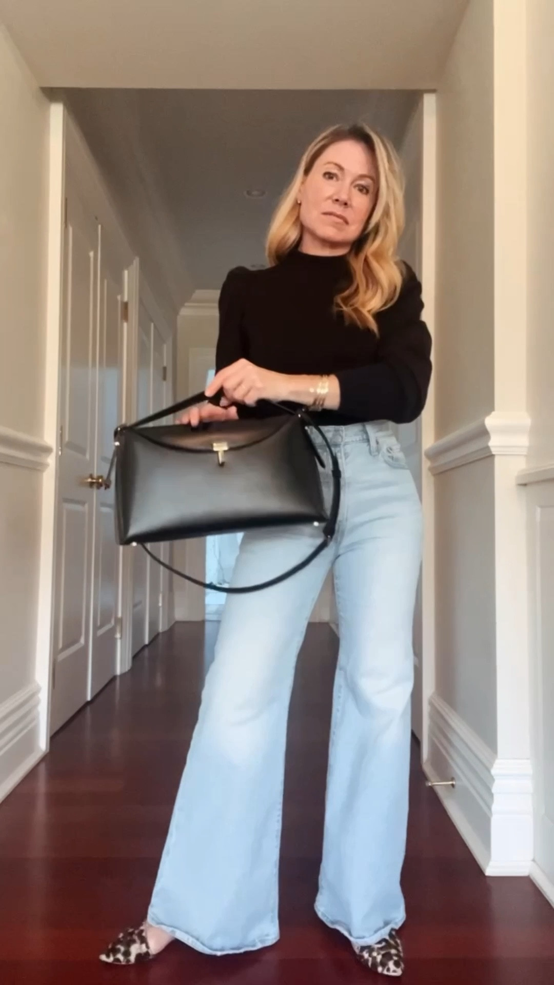 High waisted flared jeans + puff sleeve black turtleneck + leopard flats 

#LTKootd #LTKSaleAlert #LTKFindsUnder100