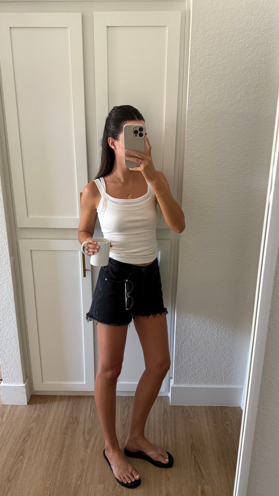 Outfit of the day! I’m 5’7” wearing my true size 25 in the shorts (I think they feel more like a mid/low rise denim short rather than high rise) I love them! And wearing a size small in the aritzia tank top and XS in the American Eagle one. Flip flops are my true size 8 and fit well! 

#LTKStyleTip #LTKSeasonal #LTKFindsUnder50