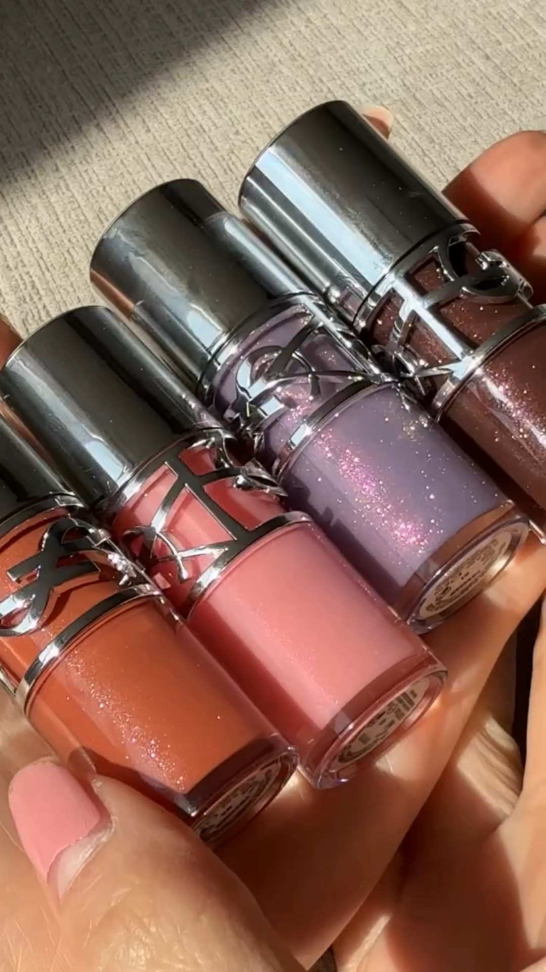 @yslbeauty love shine plumping lip oils 🩵
Shades shown: lucky moonstone, California sunshine, thunder stealer, espresso stardust 🫶

 #yslbeauty #giftedbyyslbeauty