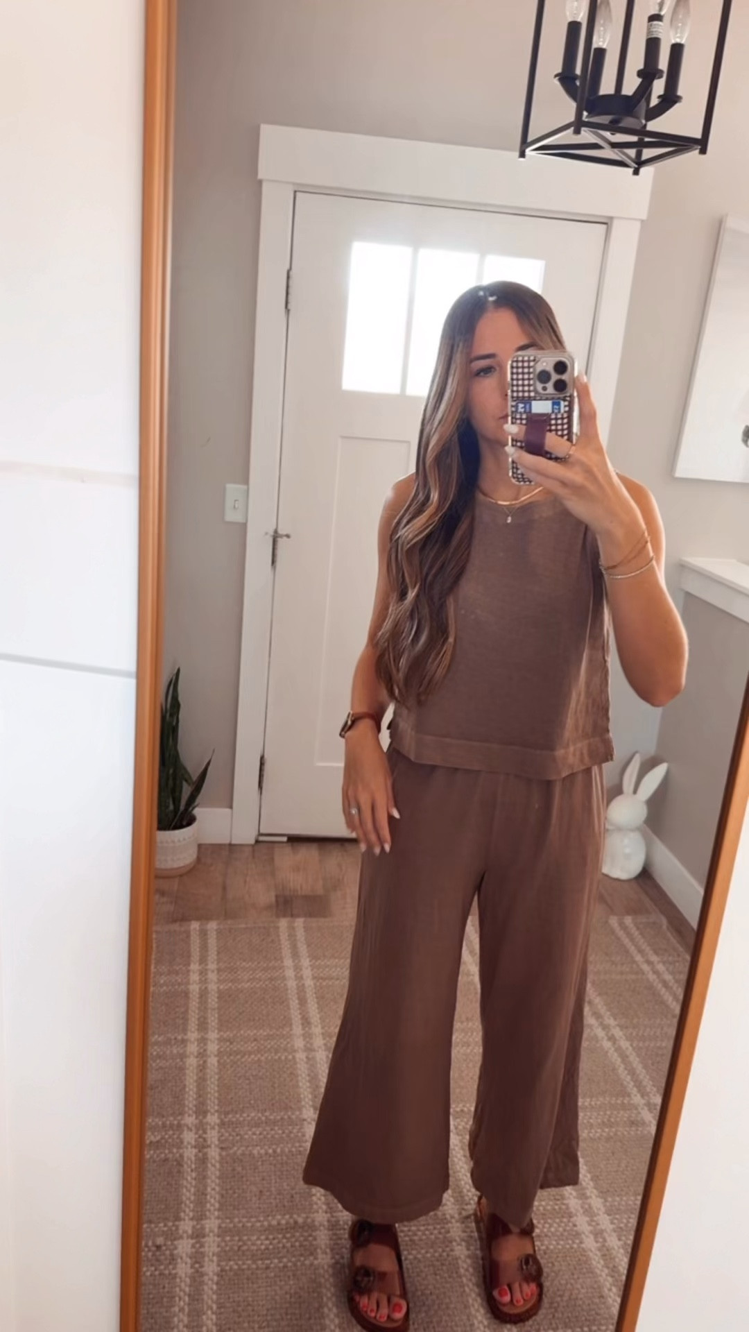 Wearing an XS in the top and S in bottoms. Also went down a size in the sandals 