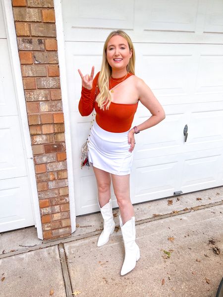 Texas game day outfit! Wearing small in everything 

Football outfit, Texas outfit, bodysuit, white tennis skirt, white boots under 50

#LTKsalealert #LTKunder50 #LTKU
