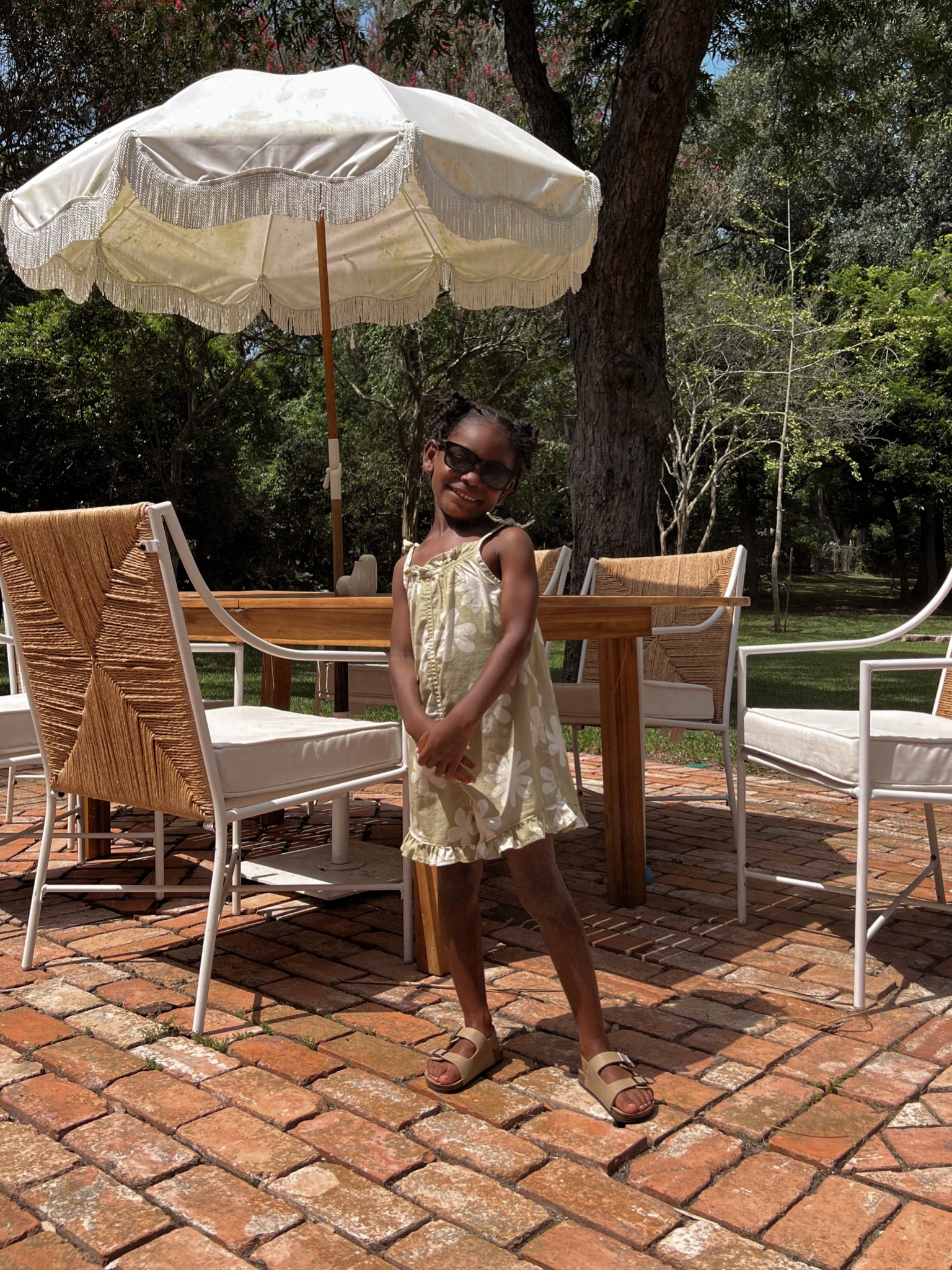 Toddler girl romper, outdoor patio chairs, umbrella 

#LTKkids #LTKfamily #LTKhome