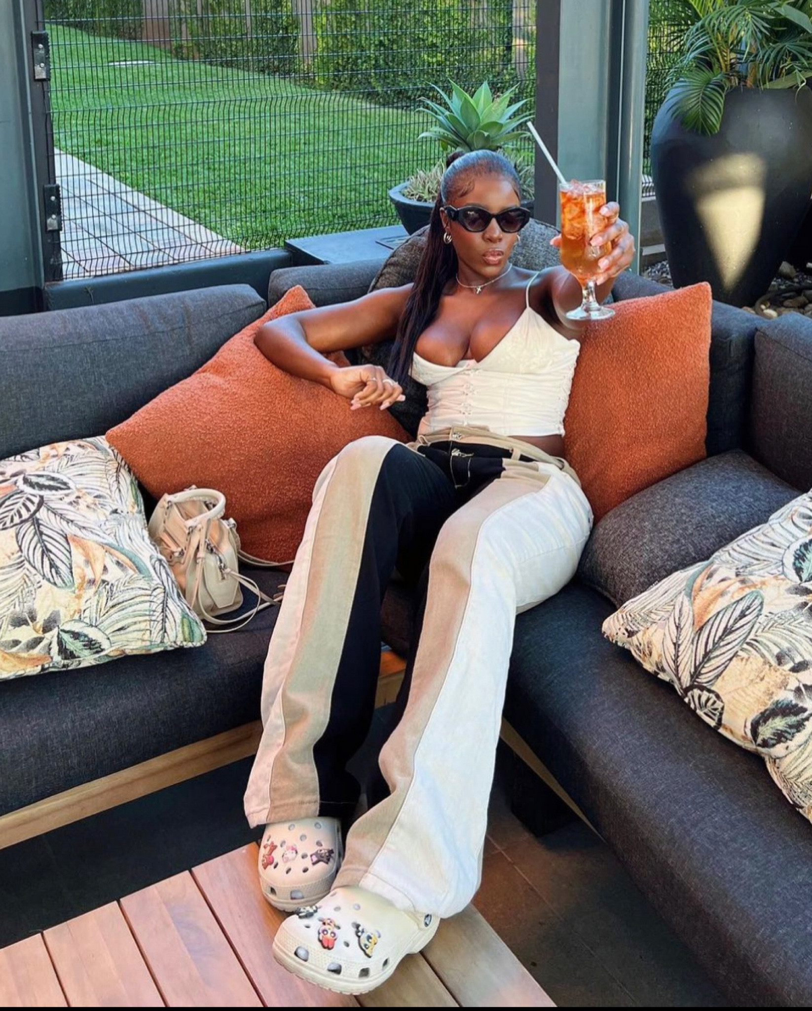 Neutral outfit, Crocs, House of CB corset top, striped jeans, boyfriend jeans, smart casual outfit, jeans and a nice top, Power Puff Girls Jibbitz, Prada sunglasses, crop top with jeans 

#LTKSeasonal #LTKeurope #LTKstyletip