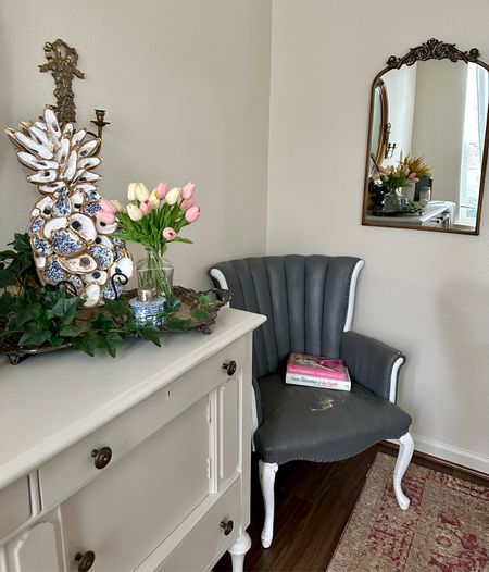 My favorite part of my house is my dining room. It has my great grandmother’s chair that my grandmother gave to me over 20 years ago, along with a vintage 1940s buffet, vintage silver tray & ginger jar. I snagged the mirror and gorgeous faux flowers from Amazon, while the hand painted chinoiserie oyster pineapple is from a small, southern woman owned business on Etsy. This would make fab living room decor as well. 

#LTKunder100 #LTKsalealert #LTKhome
