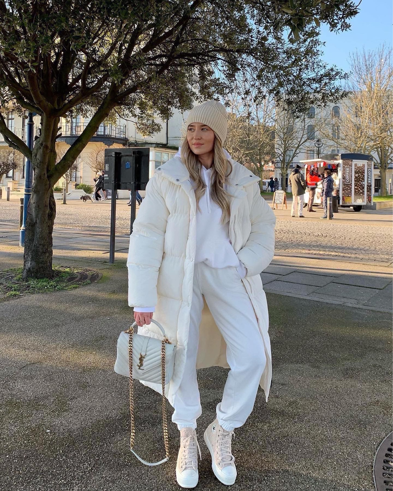 Cosy winter whites outfit, perfect for chilly days in london. Cream joggers & hoodie to stay warm, oversized white long puffer coat, white boucle converse, white ysl bag & beanie hat  

#LTKitbag #LTKshoecrush #LTKstyletip