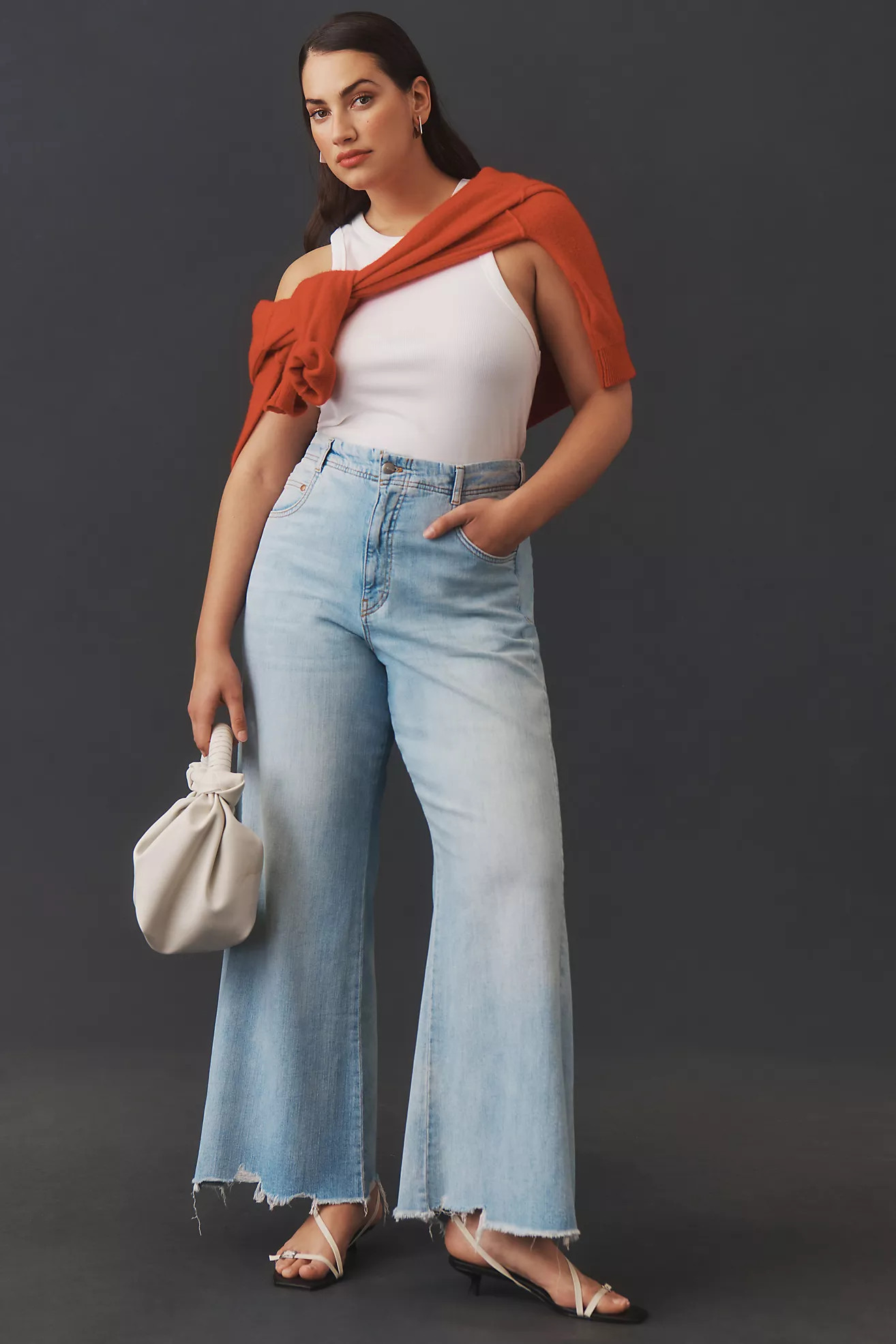 The Adi Regenerative Cotton Mid-Rise Frayed Relaxed Flare Jeans by Pilcro | Anthropologie (US)