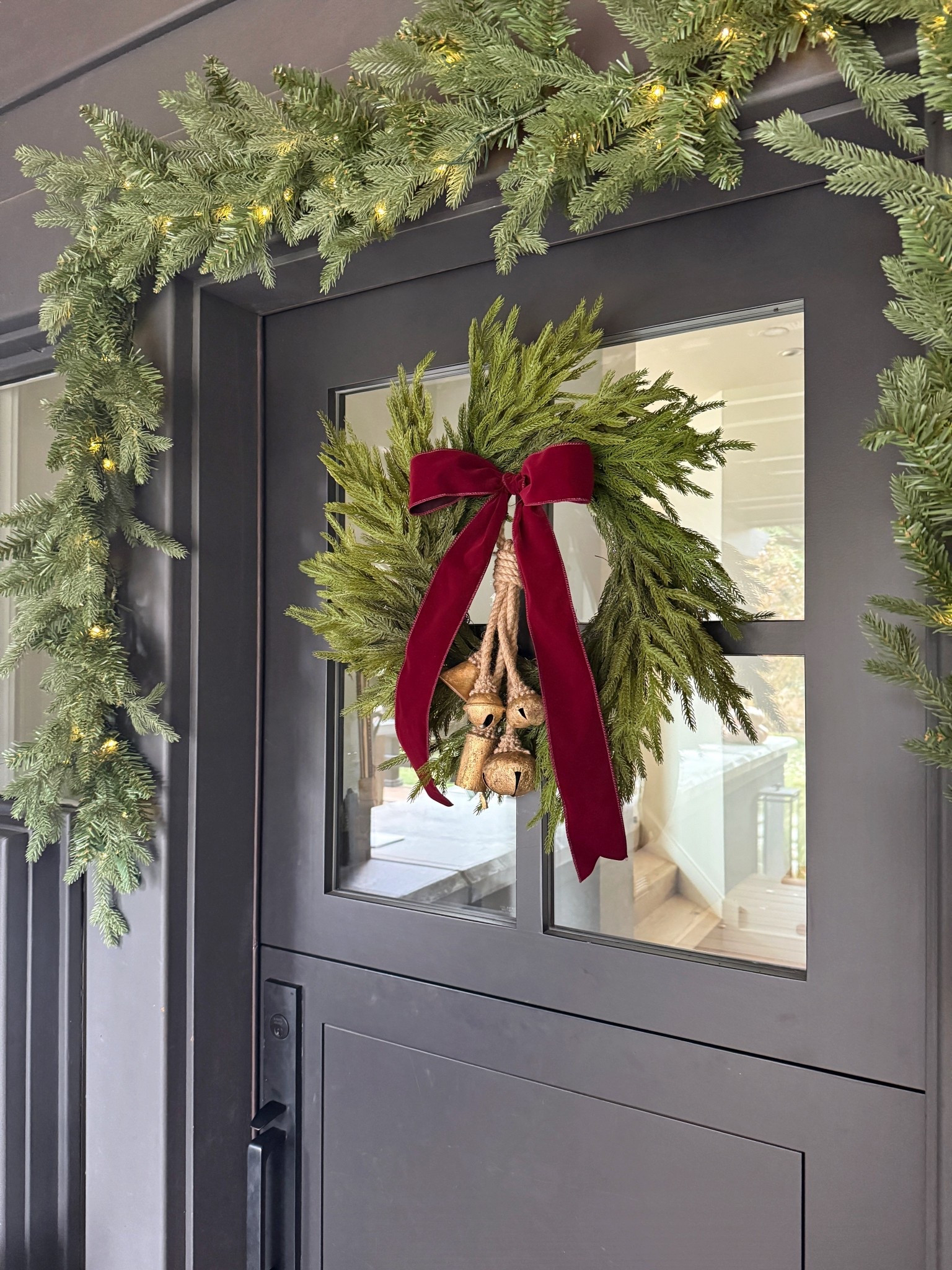 26” front door Christmas wreath from Amazon! Styled it with bells and burgundy velvet ribbon tied in a bow. Secure it on glass with a suction cup hook!

Holiday
Front door
Home Decor 

#LTKHome #LTKFindsUnder50 #LTKHoliday