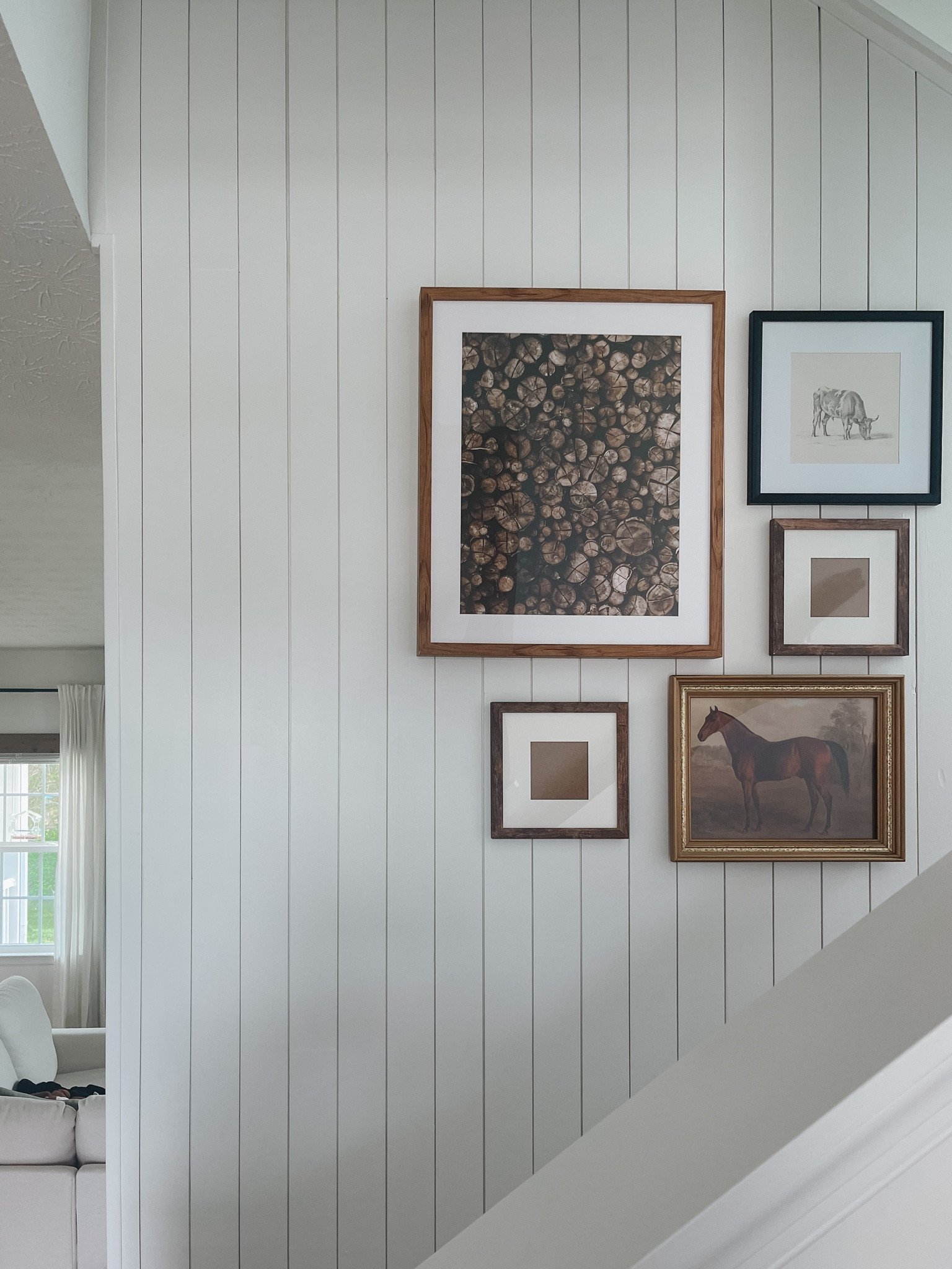 Vintage farmhouse shiplap stairwell. Black picture frames, wood picture frames and gold picture frames lining up a staircase. Vintage horse photo  
#vintageartwork
#shiplapstairwell
#picturesinstairs


#LTKhome #LTKunder50 #LTKsalealert