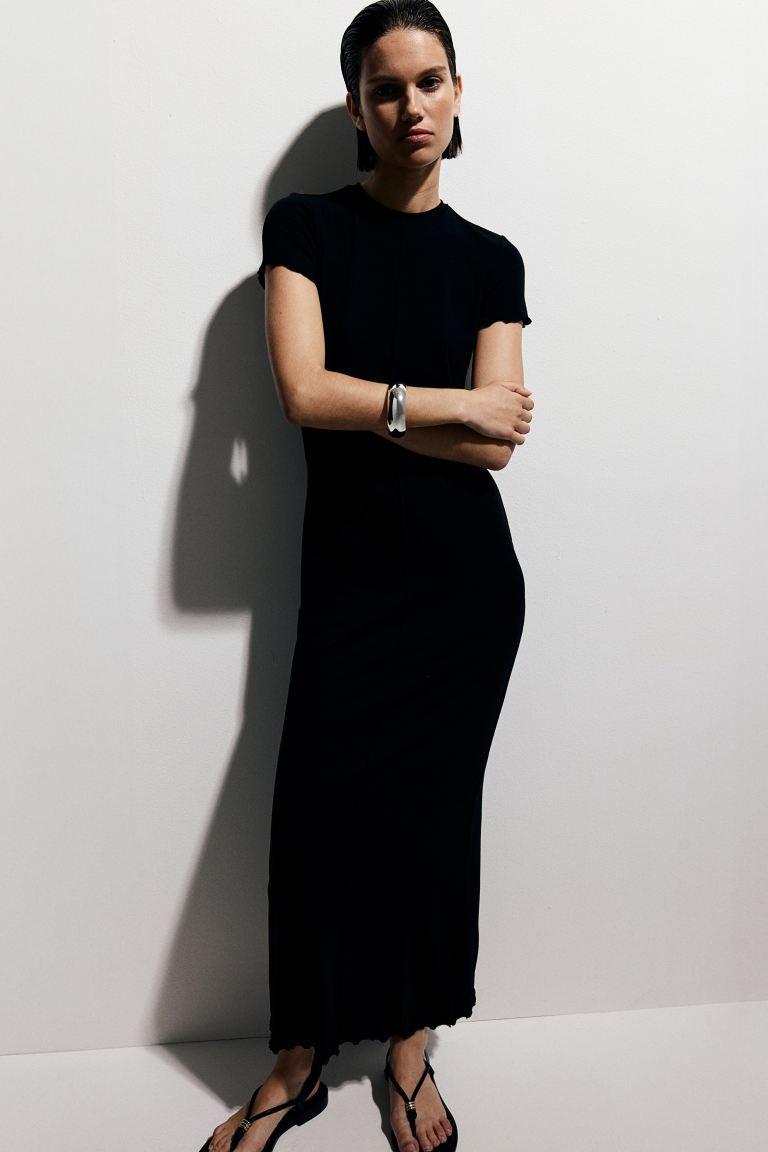 Overlock-detail bodycon dress - Round neck - Short sleeve - Black - Ladies | H&M GB | H&M (UK, MY, IN, SG, PH, TW, HK)