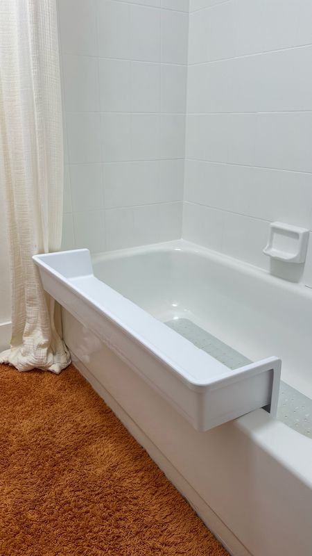 My kids make a mess of the water during bath time until I found this bath ledge that gives them a bit extra space to play and keeps the water from dripping down the side of the tub making a mess! #momwin #bathtime #bathtub #tubbytime #kids #littlekid #bath #bathaccessories #bathtoys 

#LTKHome #LTKKids #LTKBaby