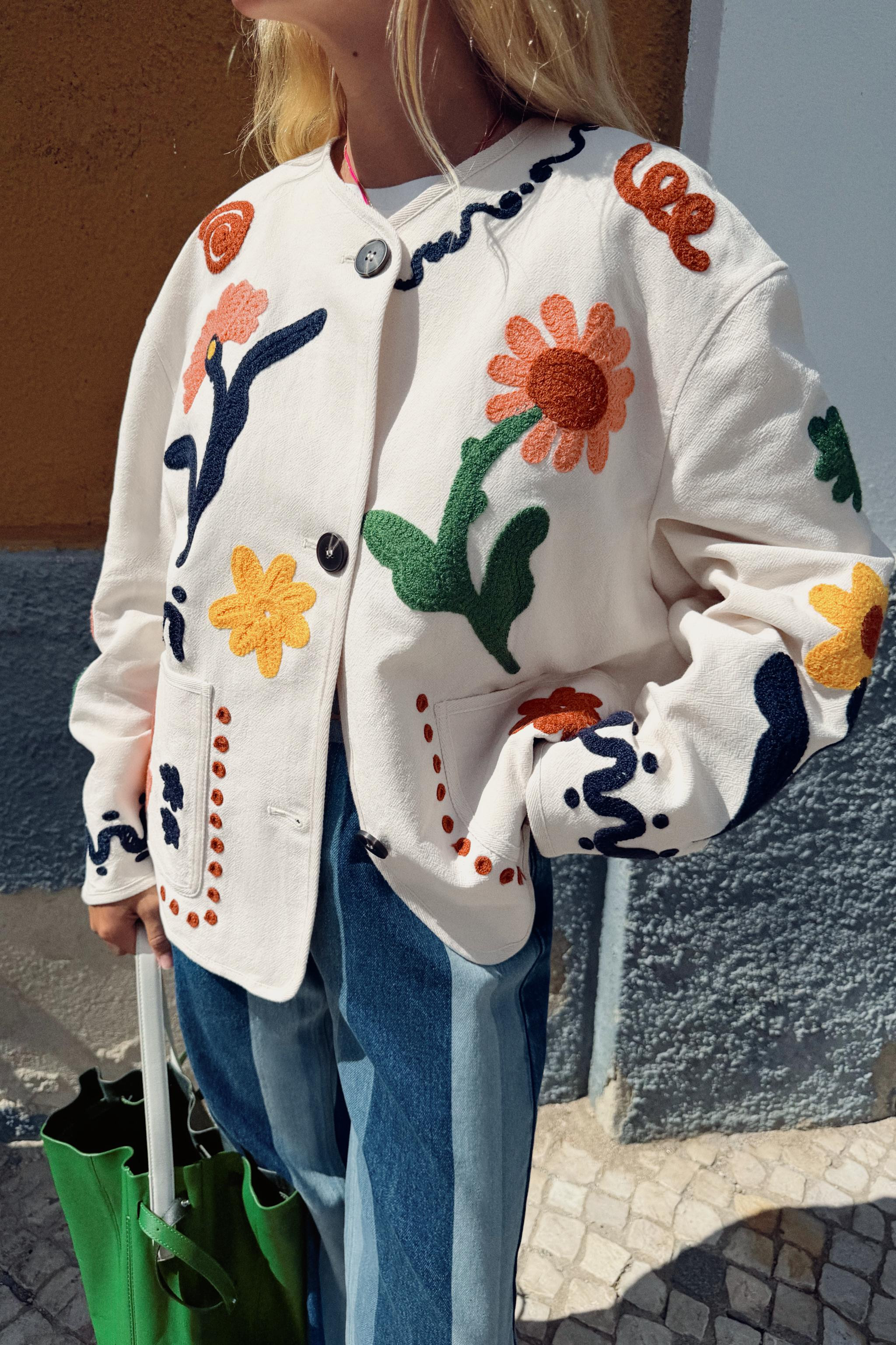 Round neck jacket with long sleeves. Front patch pockets. Mixed floral embroidery details. Front ... | Zara US