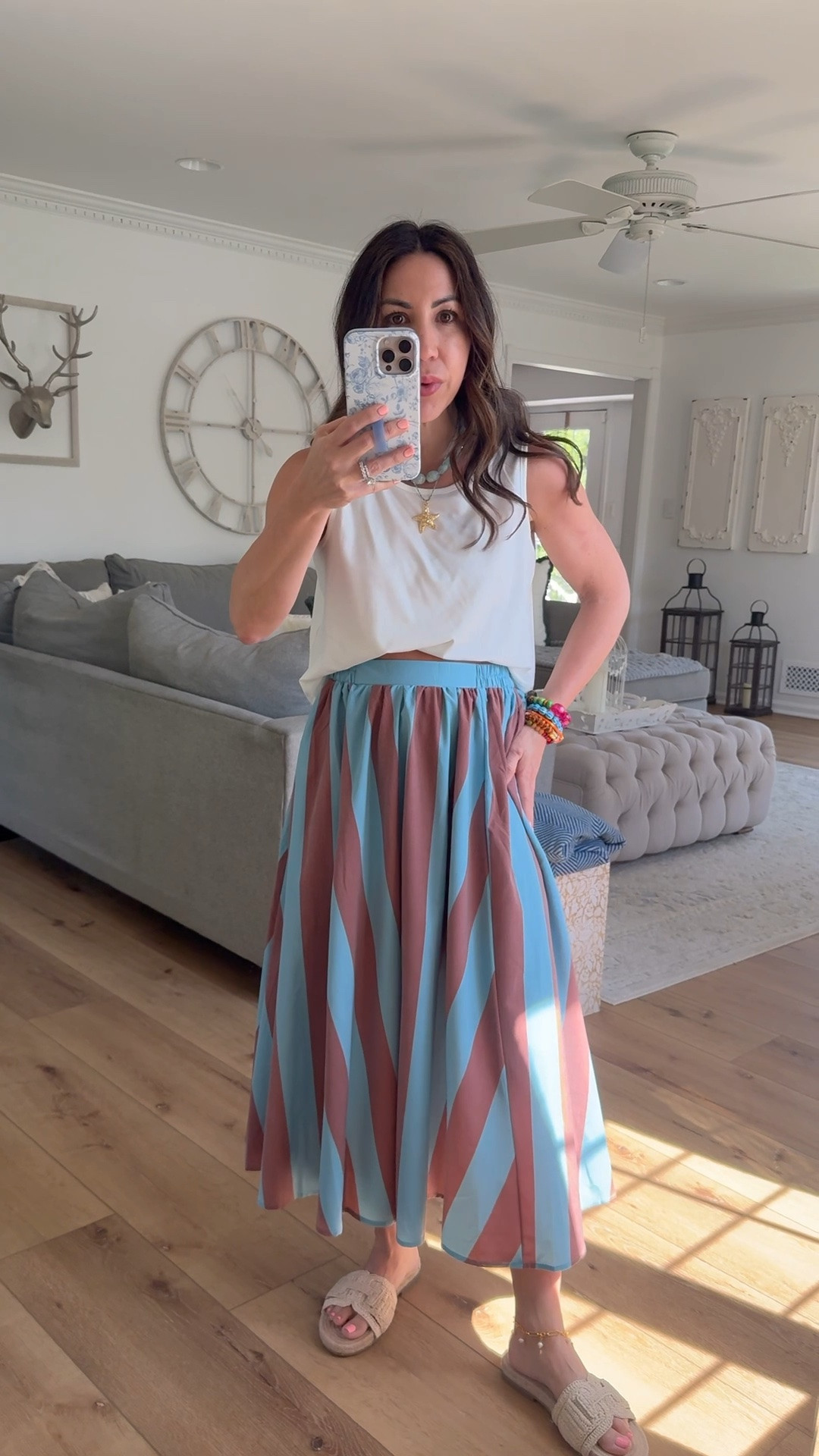 Small midi skirt. Small white tank top. Amazon fashion.

#LTKOver40 #LTKSaleAlert #LTKPetite