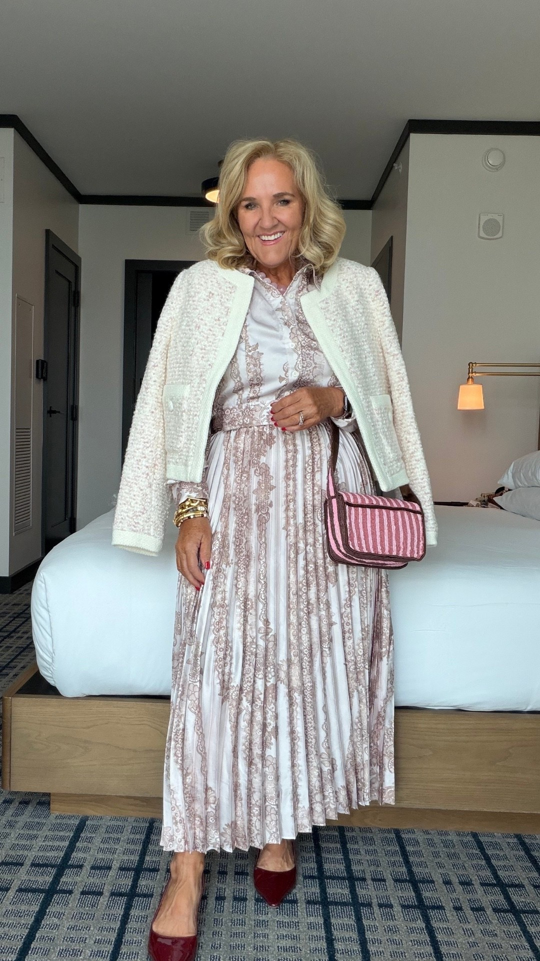 Oh my goodness, the soft print and pleated skirt on this dress are so feminine! I’m wearing a medium, and I like how the little jacket makes it feel just right for a lunch or dinner out.
