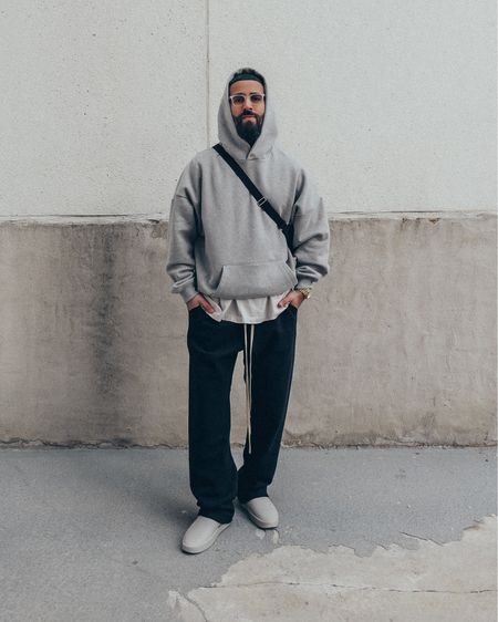FEAR OF GOD Eternal Collection hoodie in ‘Grey’ (size M) and Relaxed Sweatpants in ‘Black’ (size M), 7th Collection American Allstars Henley tee in ‘Vintage White’ (size M), and California slides in ‘Concrete’ (size 41). FEAR OF GOD x BARTON PERREIRA glasses in ‘Matte Taupe’. THE ROW Slouchy Banana Bag in ‘Black’. A relaxed and elevated men’s look that is perfect for a chill day in or out for lunch. Highly recommend each piece as a staple in the wardrobe, as each item provides versatility to dress up any outfit or down.  

#LTKmens #LTKstyletip