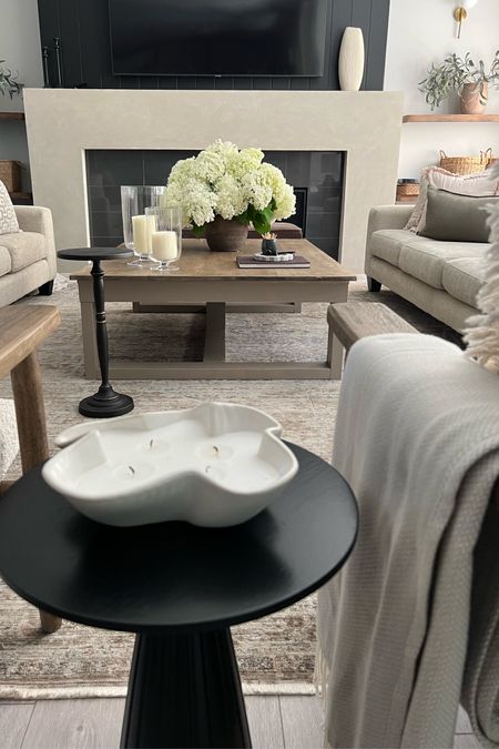 Current coffee table decor! Hydrangeas from my garden are taking center stage. But I’m linking my favourite real touch faux hydrangeas. And how pretty are  these textured glass hurricanes, love them! 
Summer styling, home decor inspiration, modern organic home 

#LTKSeasonal #LTKHome