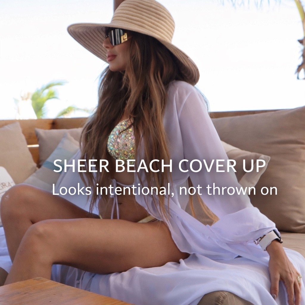 This sheer beach cover up is one of those pieces that instantly makes your swimsuit look intentional instead of thrown on.

It’s a maxi swim cover up with long sleeves, so you get coverage without feeling heavy or restricted. The fabric is lightweight and flowy, and it looks just as good worn open as it does tied at the waist. Compared to other cover ups, this one drapes better and feels more elevated for the price.

I wore this to Bagatelle Tulum, and it was perfect for a luxury beach club setting where you want to look polished but still stay cool. It transitioned easily from lounging to lunch without needing to change.

If you’ve ever felt awkward walking from the pool to lunch, this long sleeve swimsuit cover up solves that. It gives you coverage for resorts and beach clubs while still keeping that effortless vacation look.

Where you’ll actually wear it:
Bagatelle Tulum in Tulum
Resort pools and cabanas
Hotel hallways
Boat days
Walking to lunch or cocktails over a swimsuit this swimsuit cover is ideal. The flowy fit with an adjustable tie front. Runs long for a true maxi length. If you are between sizes, sizing down gives a sleeker look.

Colors available:
White
Black
Orange
Seasonal shades depending on availability

Sizes:
XS–XL (availability varies by color)

This is an easy yes if you want a swimsuit cover up that actually works beyond the pool and fits seamlessly into a vacation or resort wardrobe.       sheer beach cover up, swimsuit cover up, maxi swim cover up, long sleeve swim cover up, tie front cover up, Bagatelle Tulum, Tulum beach club outfit, Tulum Mexico resort wear, luxury beach club style, poolside cover up

#LTKFindsUnder100 #LTKTravel #LTKootd
