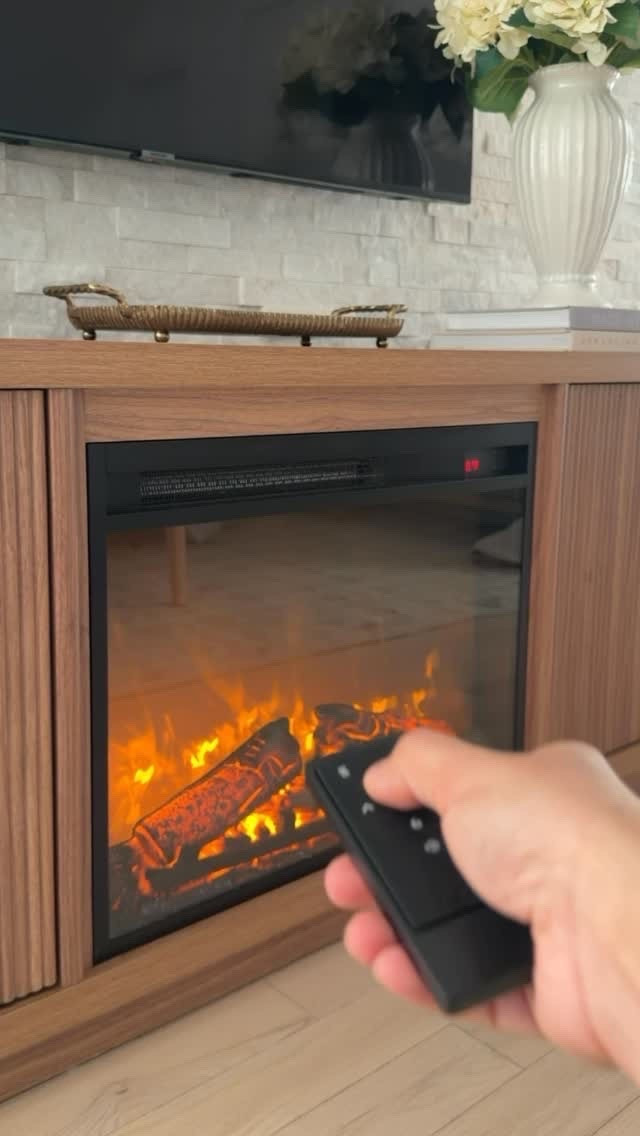 A TV stand with a built-in fireplace? Absolutely. 🤎🔥

This is such a cozy Amazon find, combining extra storage with that warm fireplace glow that instantly makes a room feel more inviting.

Perfect for creating that cozy, layered look without adding a lot of extra decor. One of those pieces that’s both practical and pretty. ✨

#LTKHome #LTKSeasonal #LTKmomlife