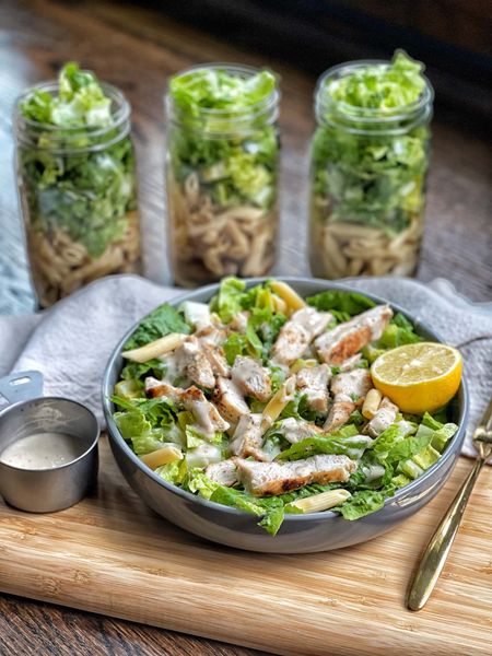 Grilled Chicken Caesar Pasta Mason Jar Salads. Wide mouth mason jars are a must for meal prep! It makes it so much easily and portable. Use the 2 piece metal lids they come with or purchase plastic reusable ones.

Two delicious worlds coming together for a macro-match made in heaven: grilled chicken Caesar salads, and pasta!  These grilled chicken Caesar pasta mason jar salads are ideal for meal prep: these mason jar salads are layered with bright, fresh and flavorful grilled chicken strips, cooked pasta, and romaine lettuce.  Served with your favorite bottled Caesar dressing, this recipe couldn’t come together easier. Full recipe on www.sweetsavoryandsteph.com

#LTKSeasonal #LTKhome