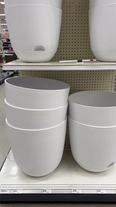 The best coastal grandmother/euro style planters with a reservoir in the bottom to save your plants in days you miss watering! I love them for tomatoes! 
