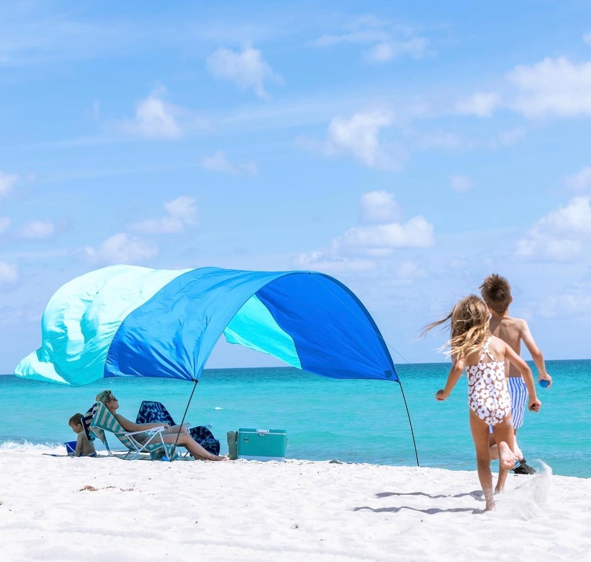 Shibumi Shade 3.0 Version | Wind-Powered Beach Tent Shade Canopy | Sets Up in 3 Mins | 150 Sq. Ft. of Shade for up to 8 People | Includes Wind Assist | UPF 50+ Sun Protection

Beach tent