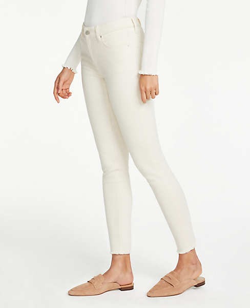 Petite Curvy Frayed Hem Performance Stretch Skinny Jeans | Ann Taylor (US)