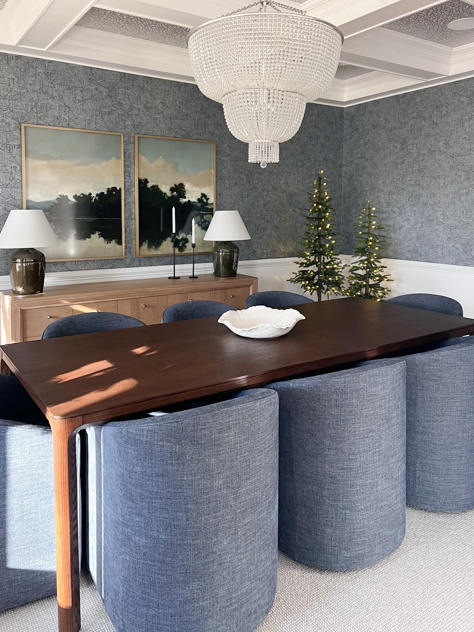 Holiday dining room inspo ✨

One of my favorite dining rooms to date! We embraced wallpaper that was already up and designed the room around it: cozy upholstered chairs in the prettiest blue, a walnut dining table, the perfect art pairing and a console that fits the room appropriately. We mixed in a few affordable pieces too! 

#LTKSeasonal #LTKHome #LTKHoliday