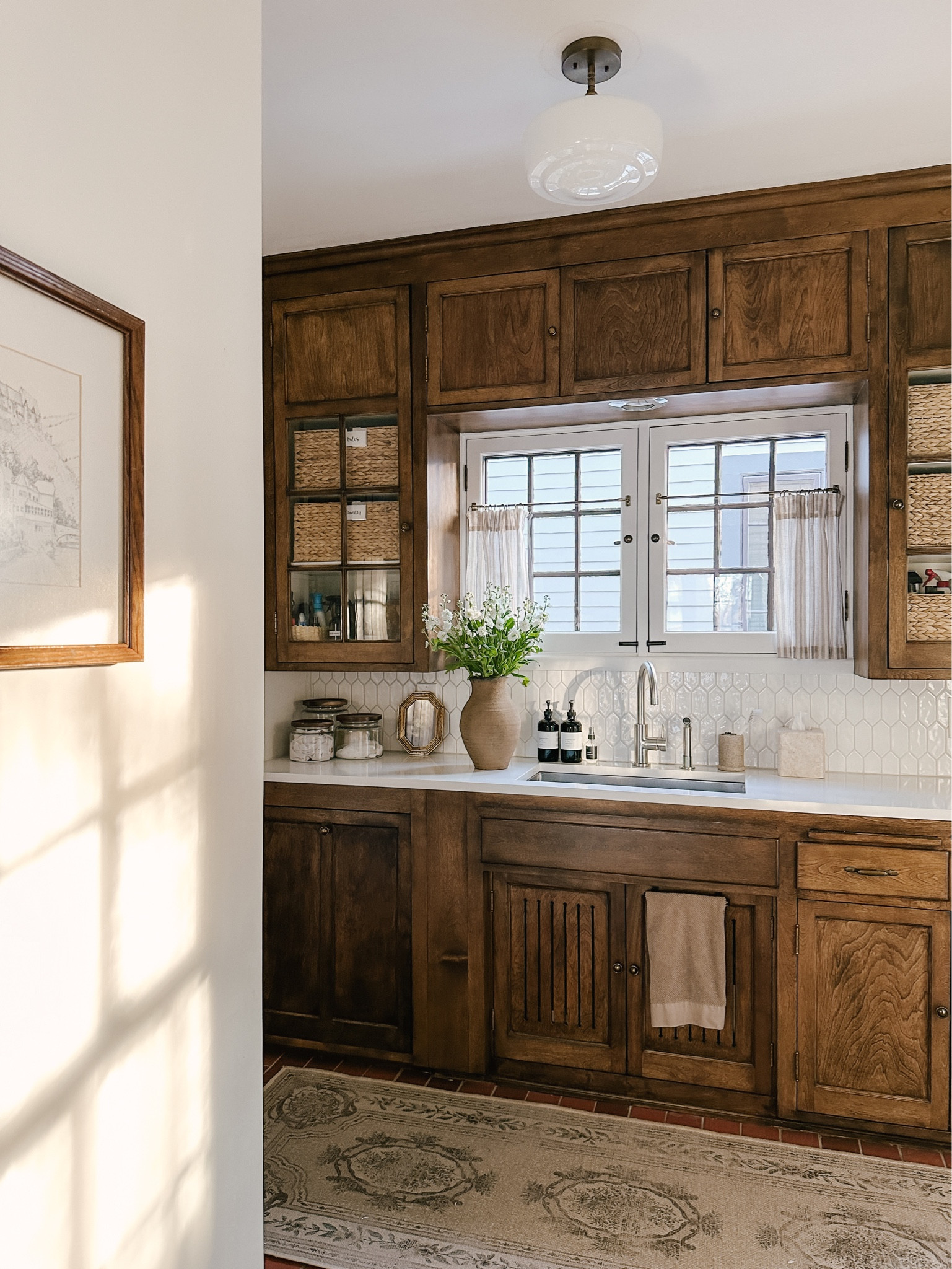 Lately. View of our laundry room. So happy to see the sun come out. Love this clay vase with any flower in them. *cafe curtains, faucet, soap dispenser, hand towel, washable rug, backsplash, glass storage canister  

#LTKhome #LTKstyletip
