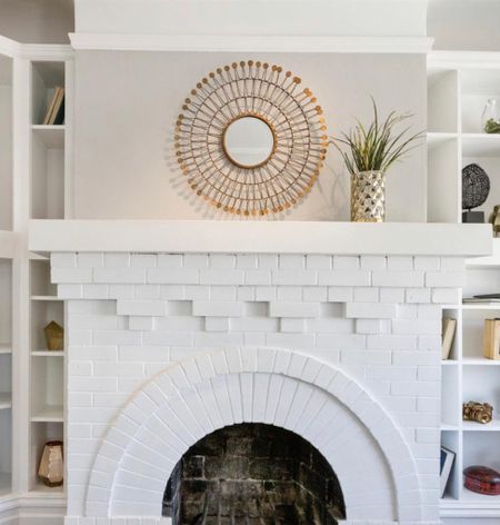 Accent mirrors over the fireplace are a great way to reflect light and add a focal point. 

Love this starburst gilded gold frame! Shop similar items in post. 

#LTKhome